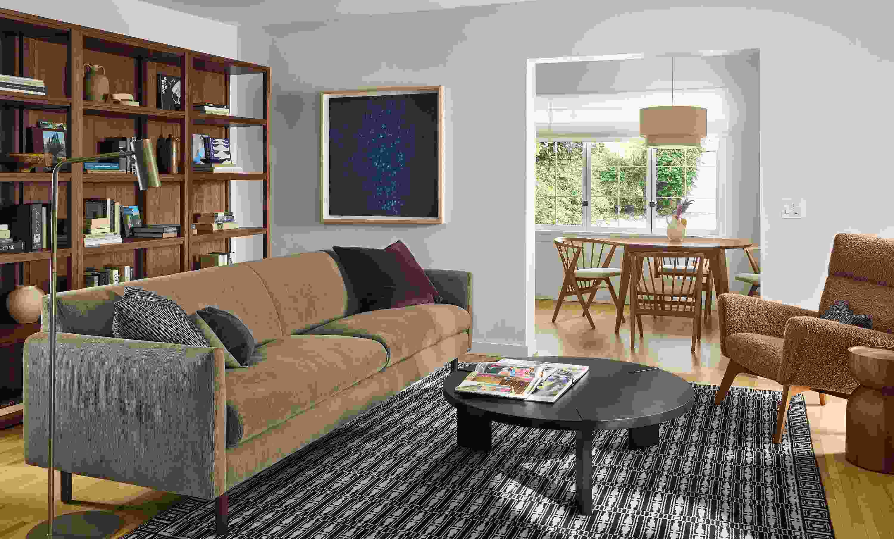 Living room with Vienna 100-wide sofa in Nigel Otter, Hanover 42-diameter coffee table in charcoal and Tulum rug in ebony.