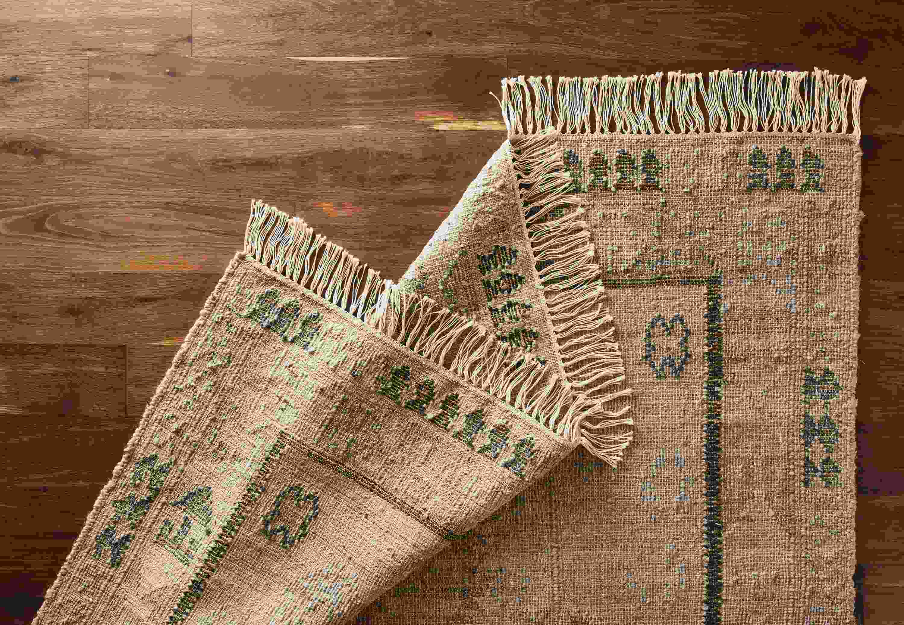 Detail of Villa rug in sand.