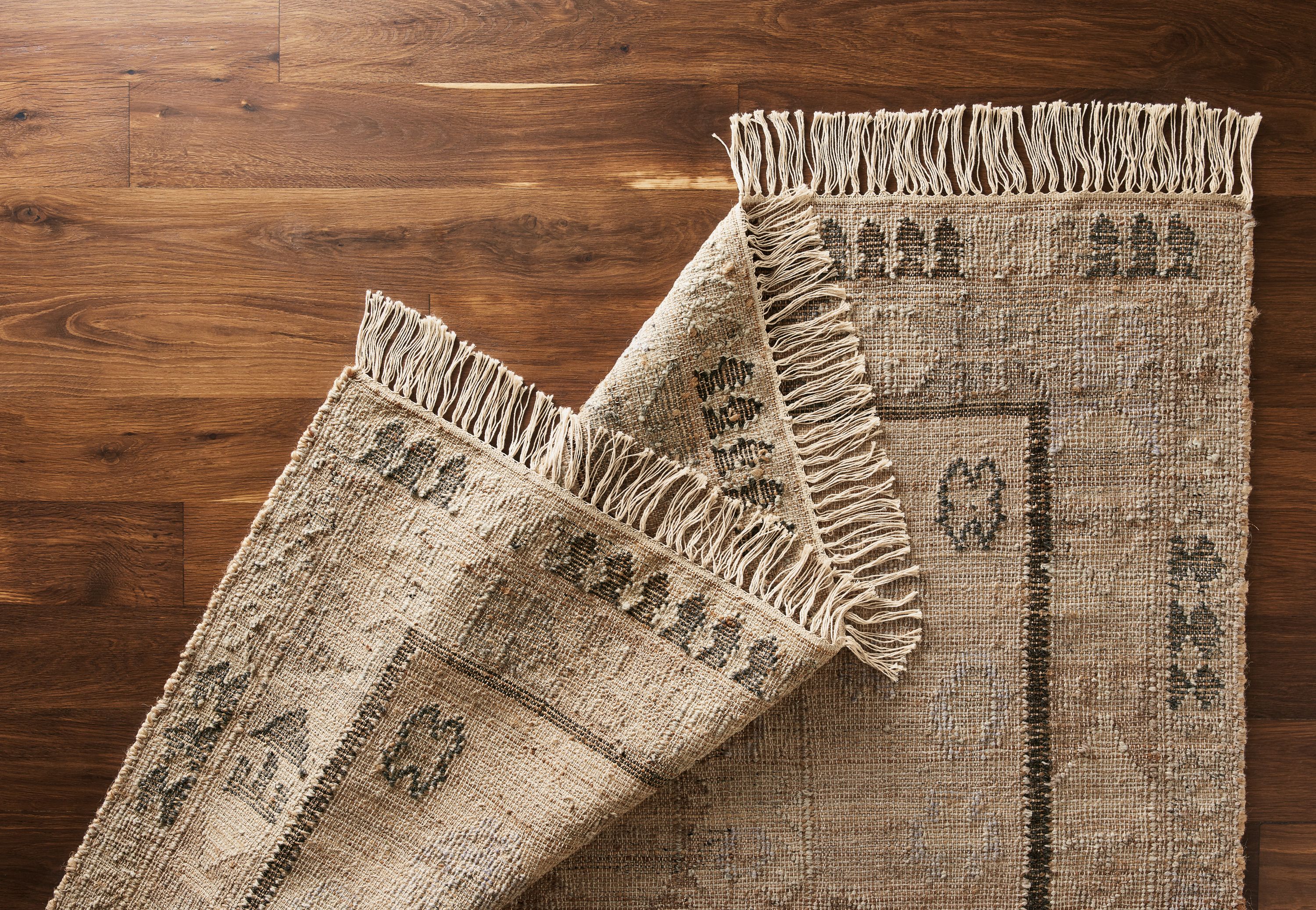 Detail of Villa rug in sand.