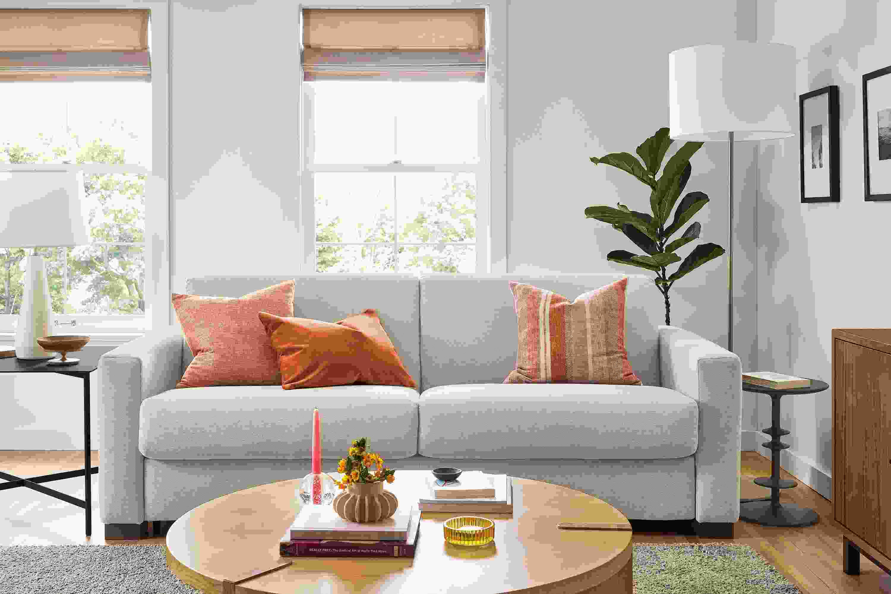 Living area with Viva fold out sleeper sofa in Sussex cement fabric and Hanover coffee table in white oak.