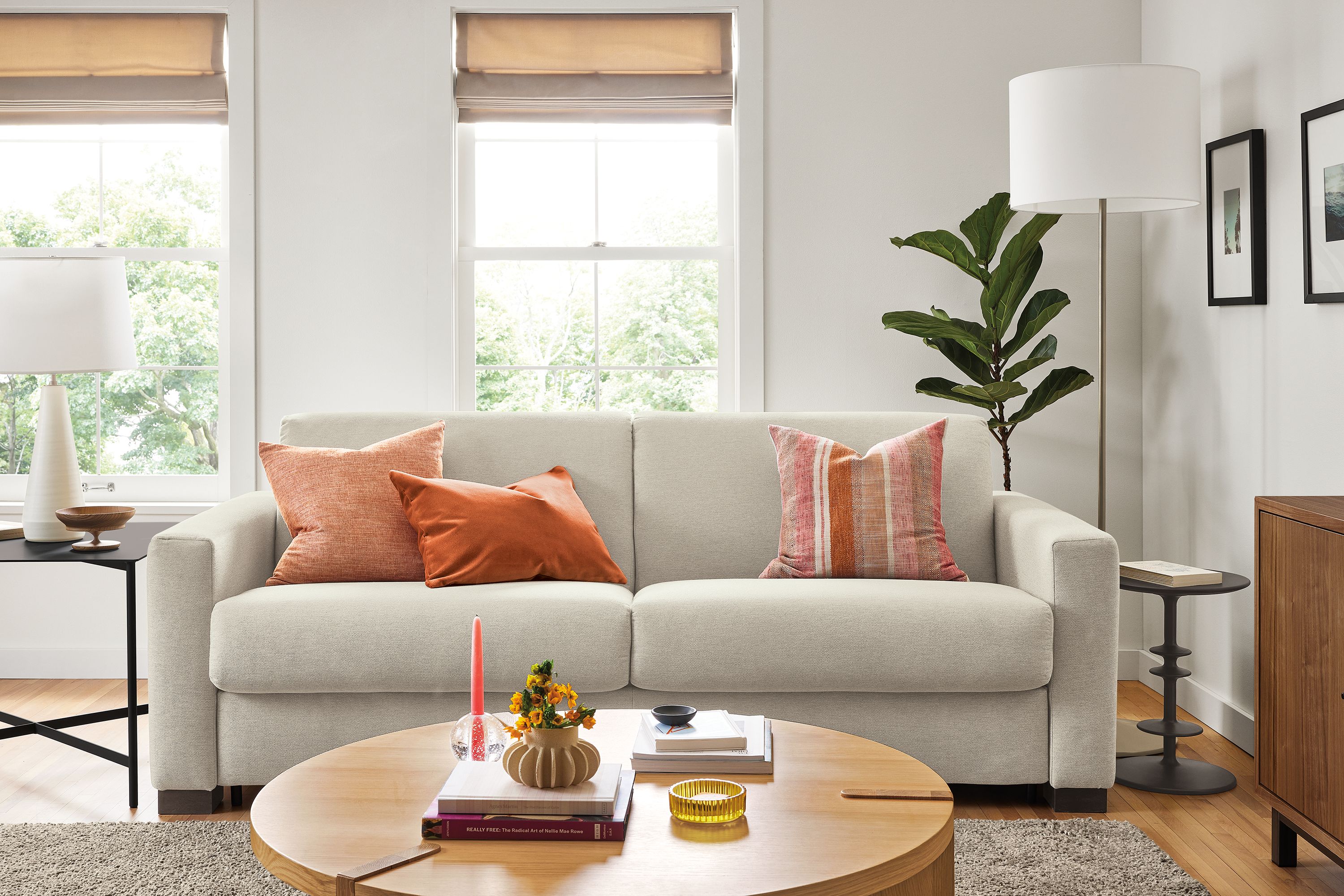 Living area with Viva fold out sleeper sofa in Sussex cement fabric and Hanover coffee table in white oak.