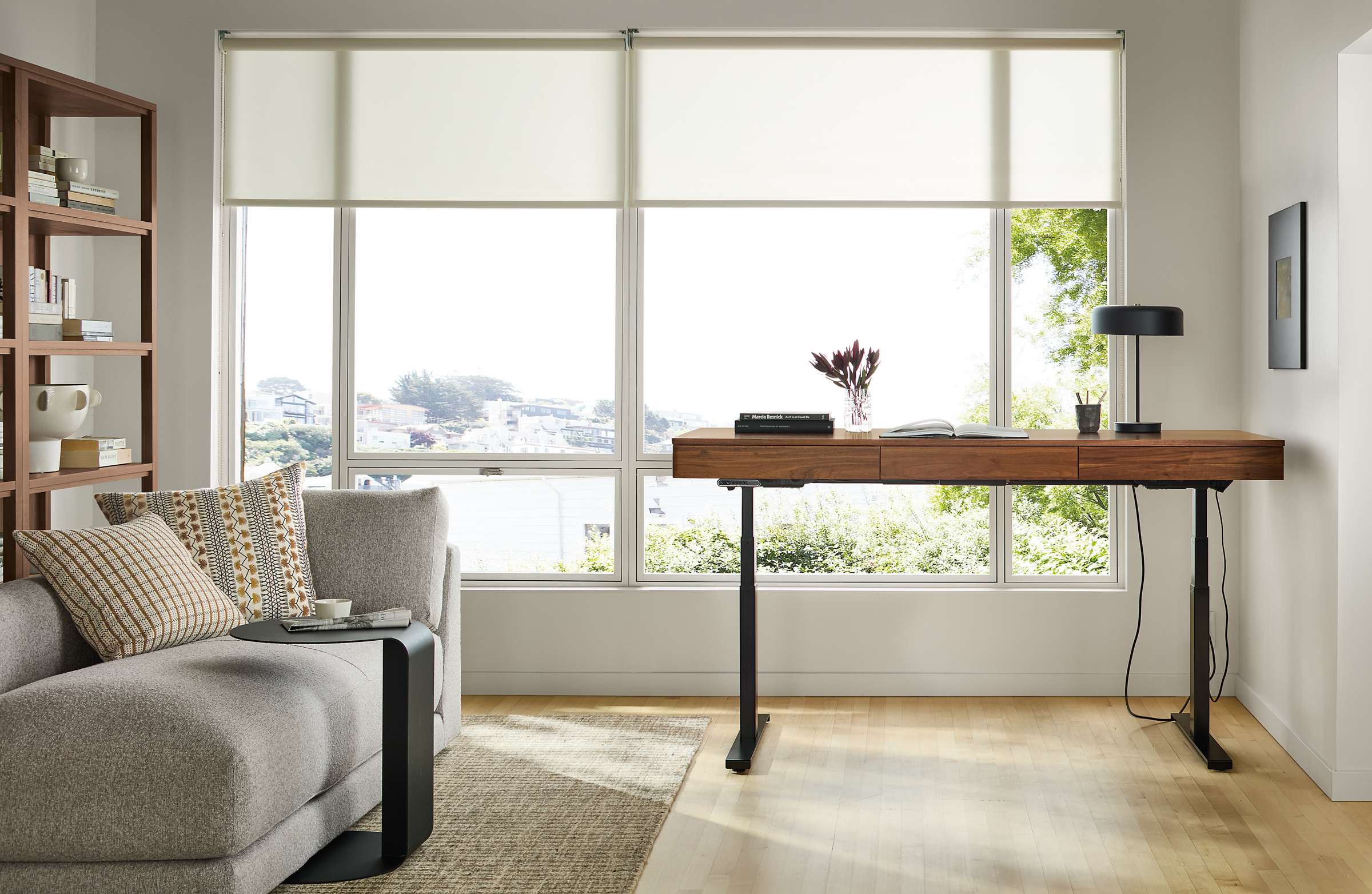 72w desk with left controller in walnut/graphite; raised to standing height