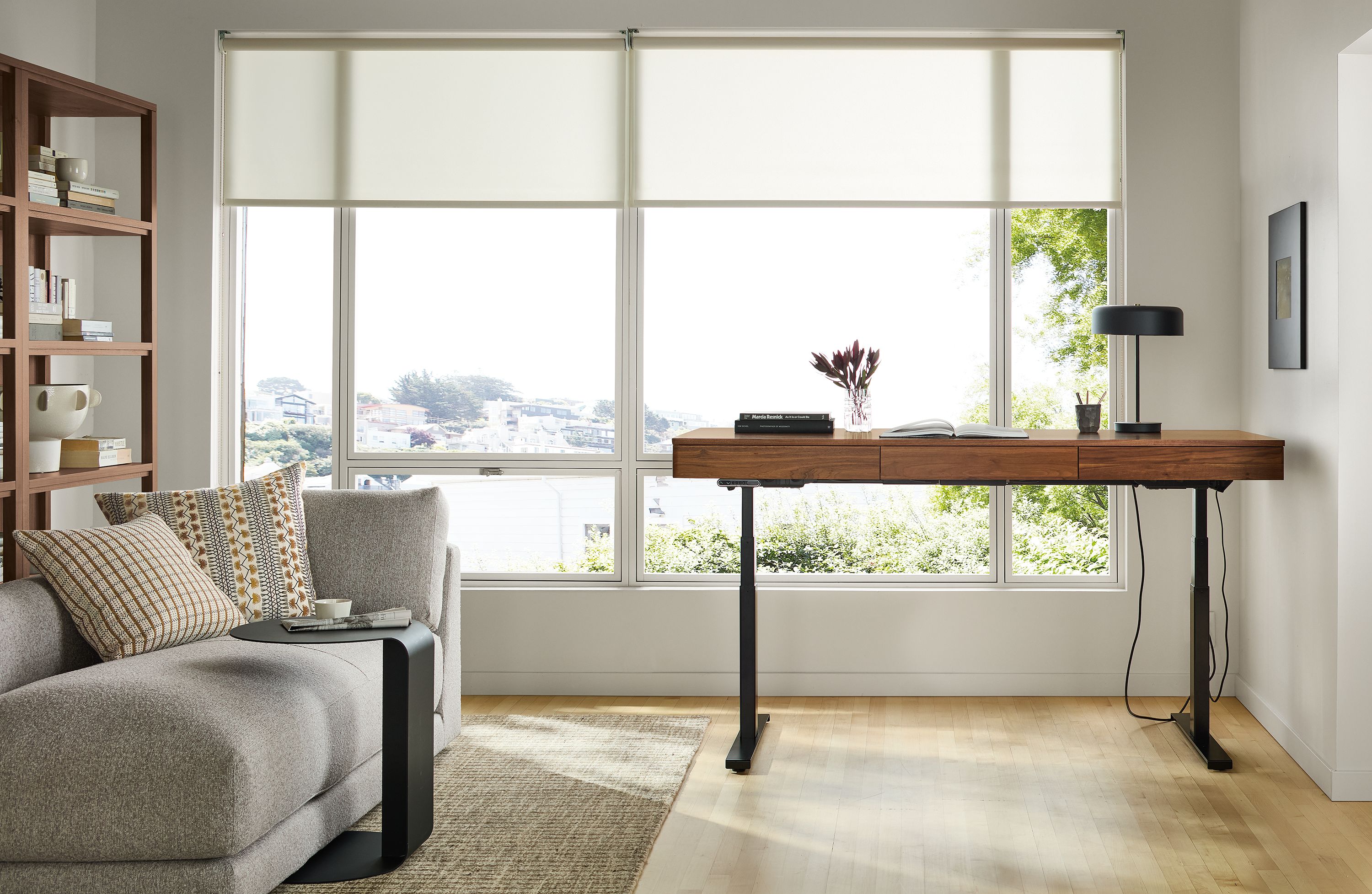 72w desk with left controller in walnut/graphite; raised to standing height