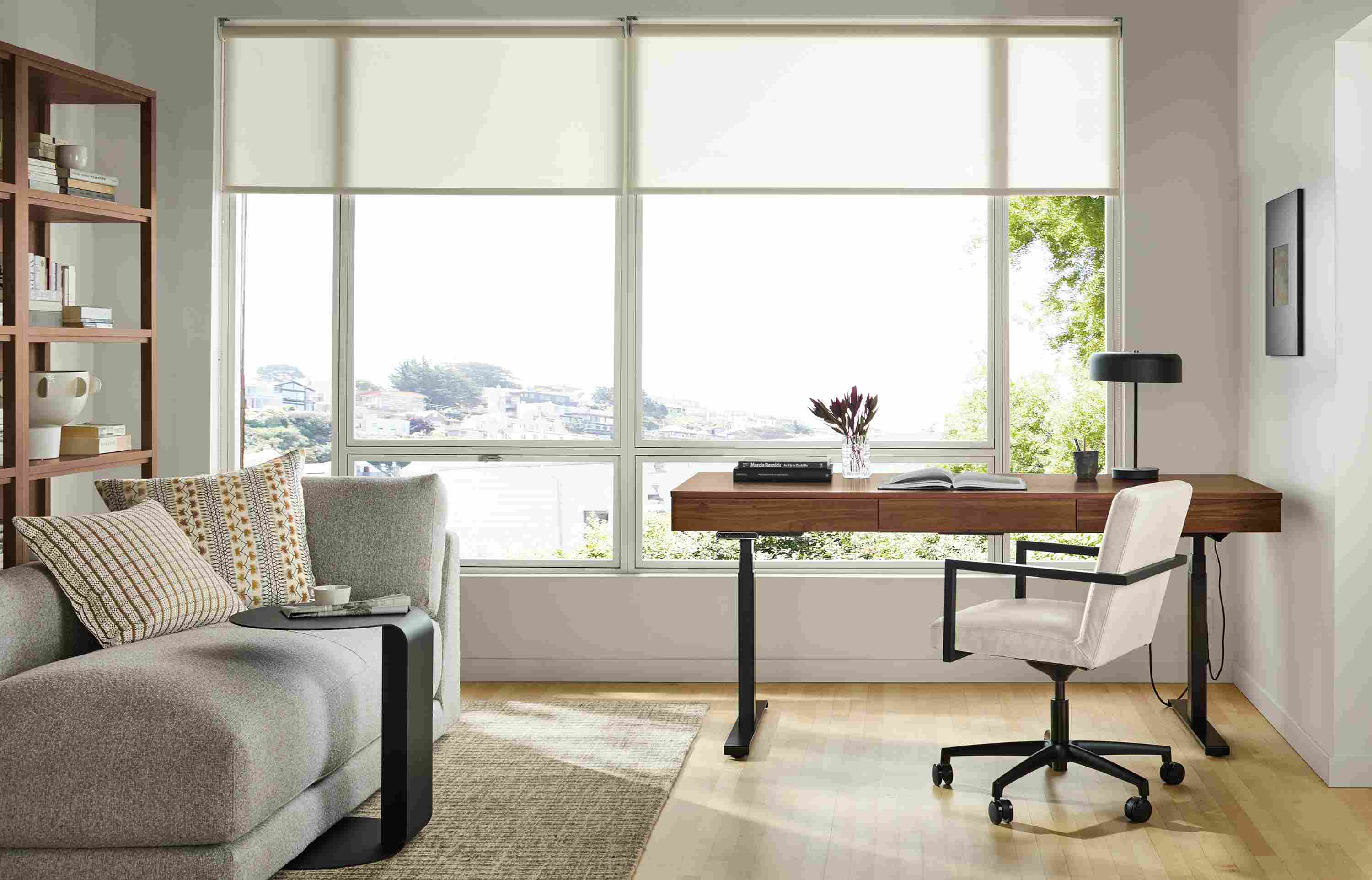 Home office with Wade 72-wide adjustable standing desk in walnut and Lira office chair in Laino Bone.