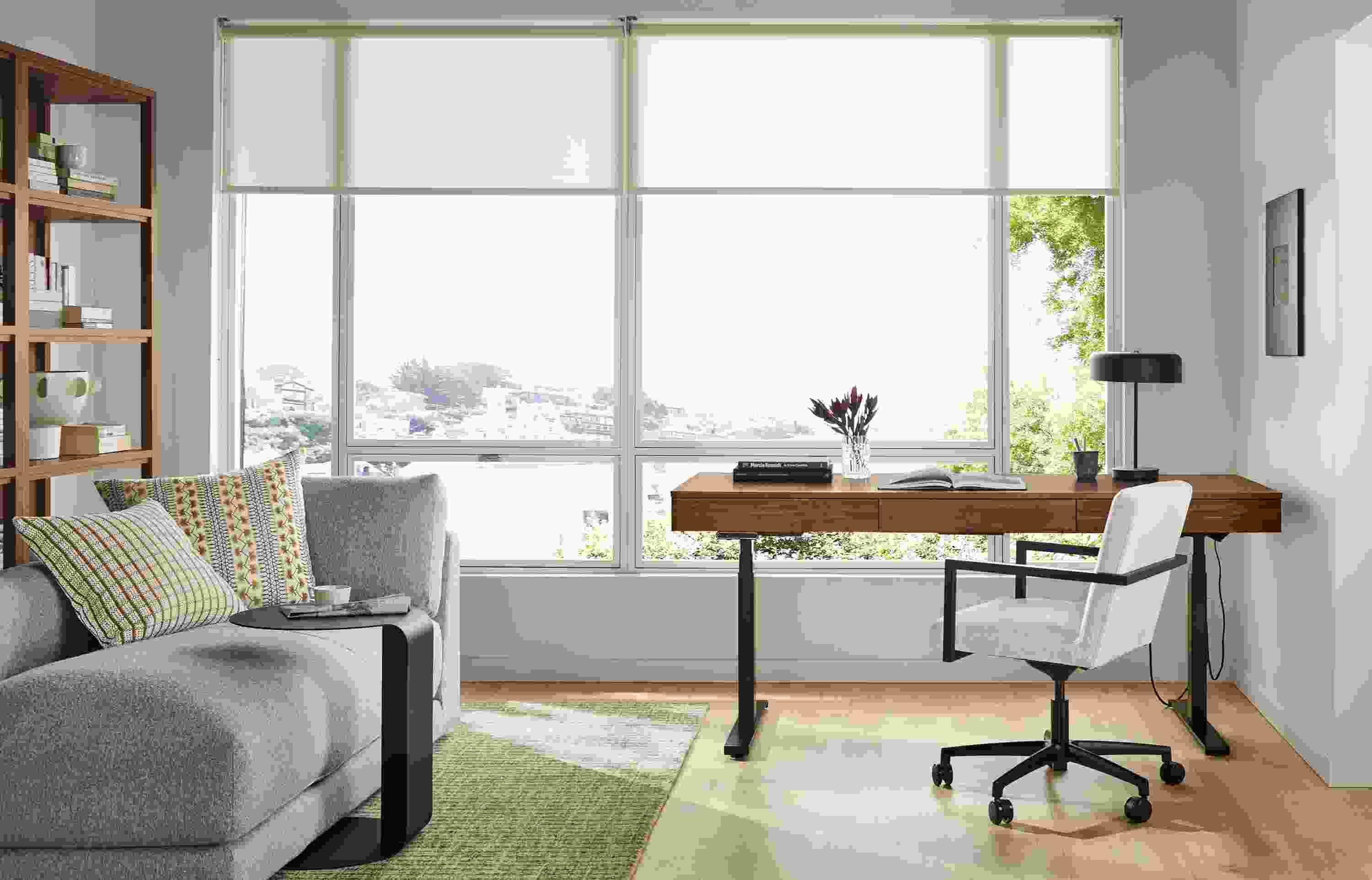 Home office with Wade 72-wide adjustable standing desk in walnut and Lira office chair in Laino Bone.