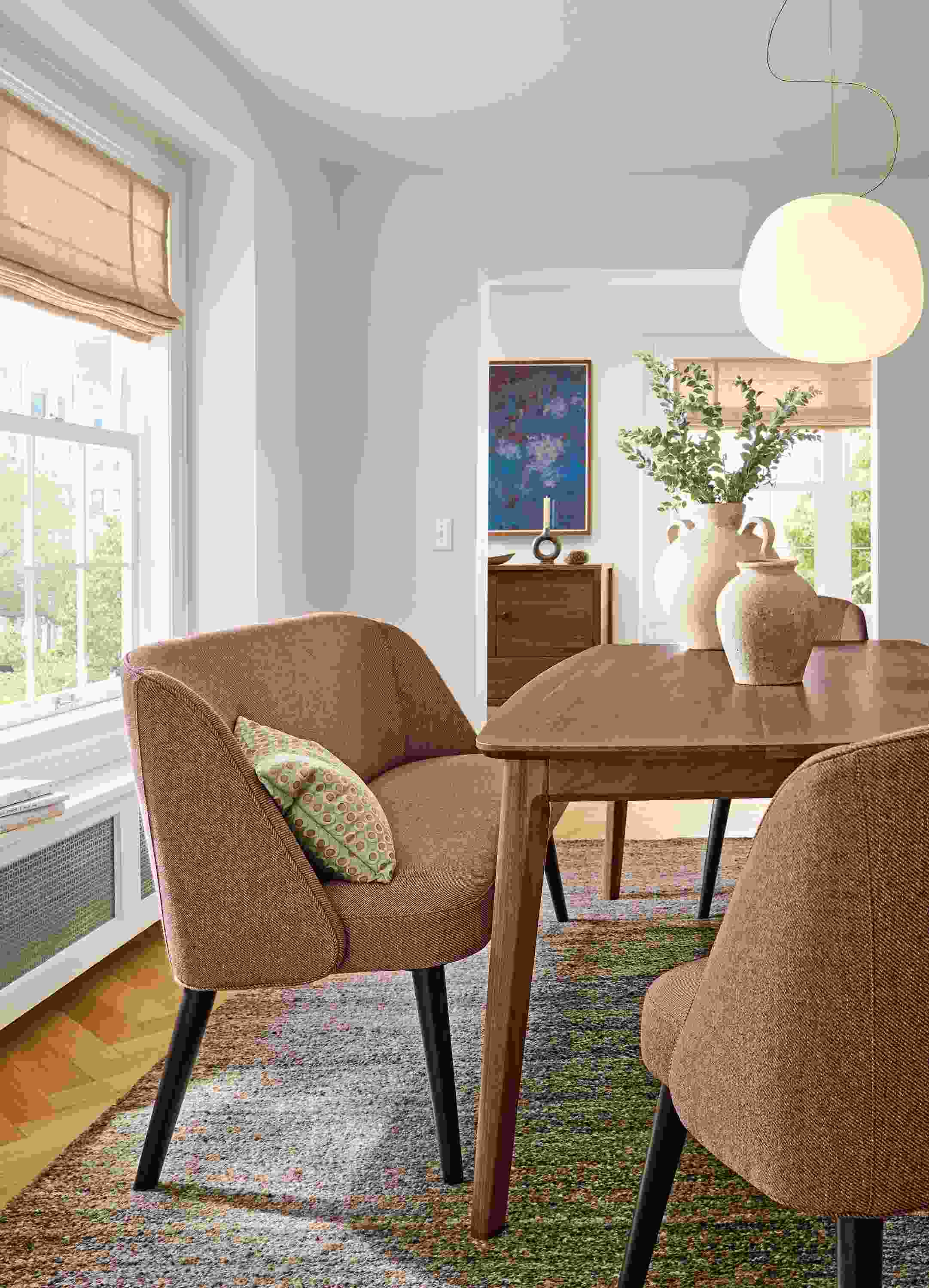 Dining room with Walcott 75-wide table in walnut and Cora bench and dining chairs in Derry Claystone with charcoal legs.