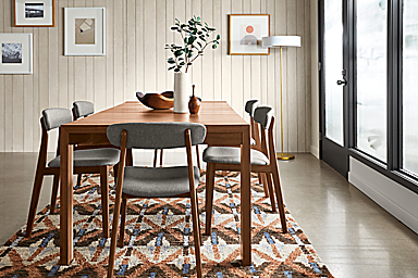room setting including 80-wide walsh extension dining table, 6 errol dining chairs, rava rug.