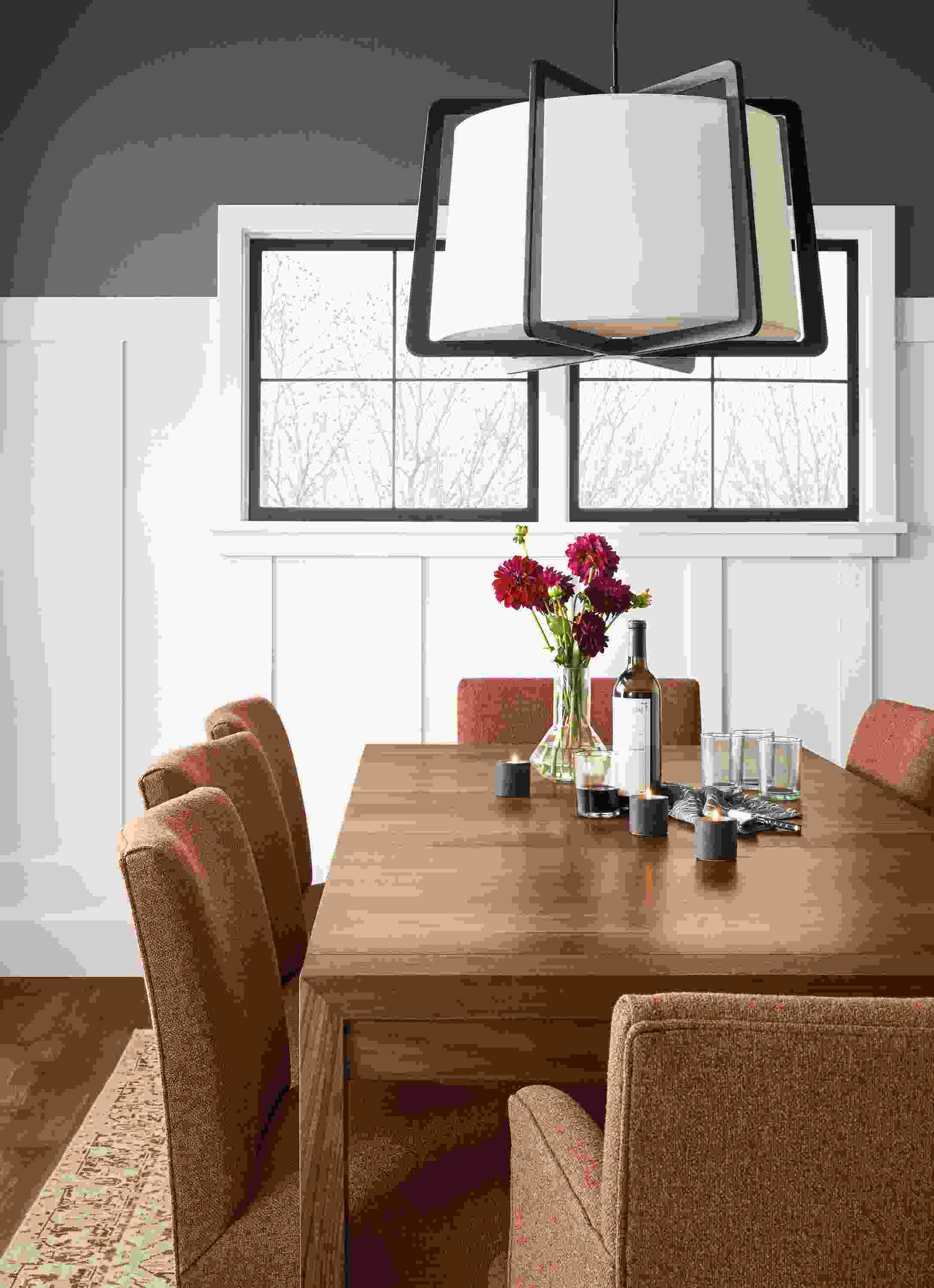 Detail of Walsh extension table in walnut in dining room with Marie chairs in Tatum Terracotta.