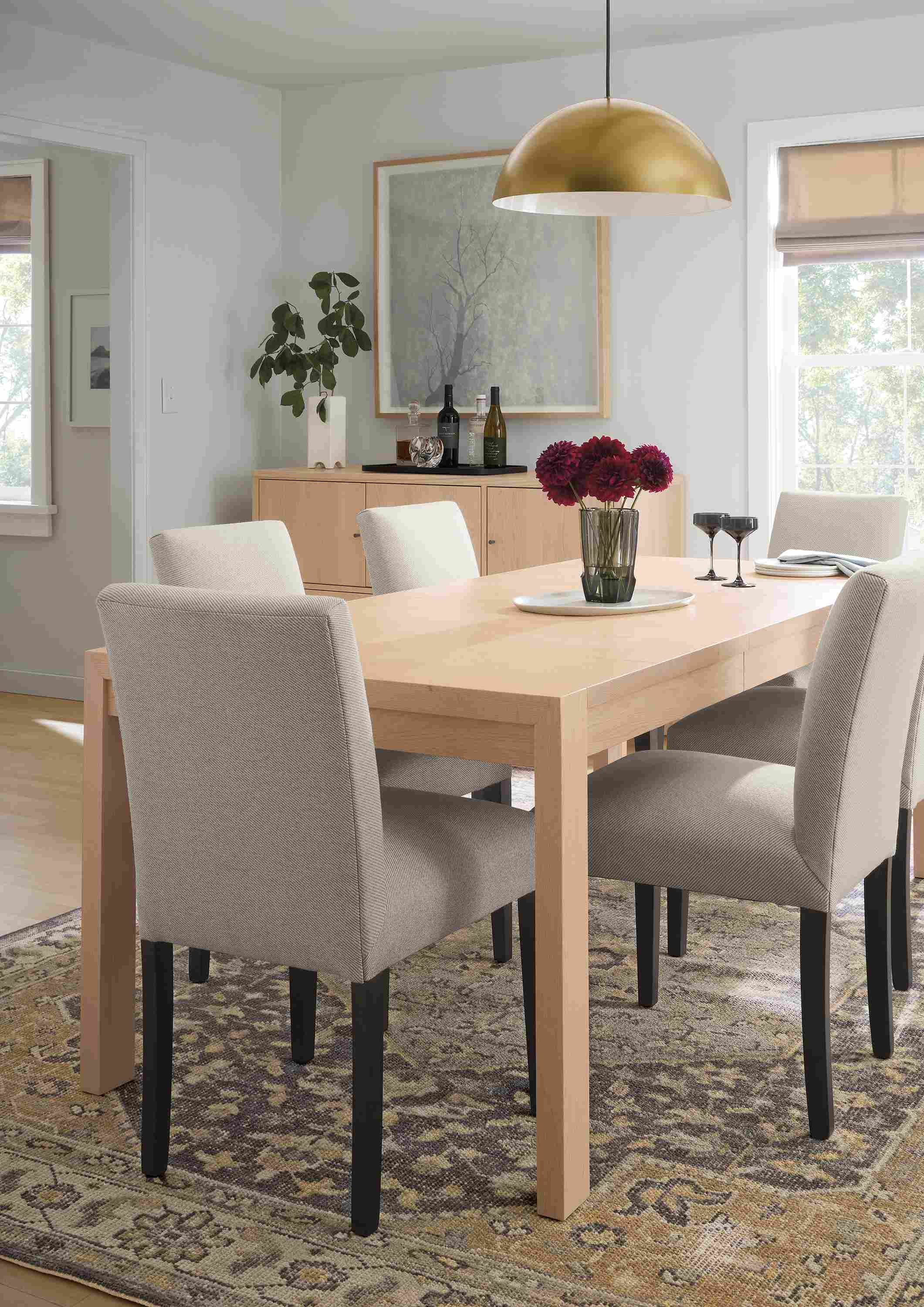 Dining room with Walsh 60-wide extension table in salt on red oak, 6 Peyton side chairs in Derry Natural and Veda rug in Smoke.
