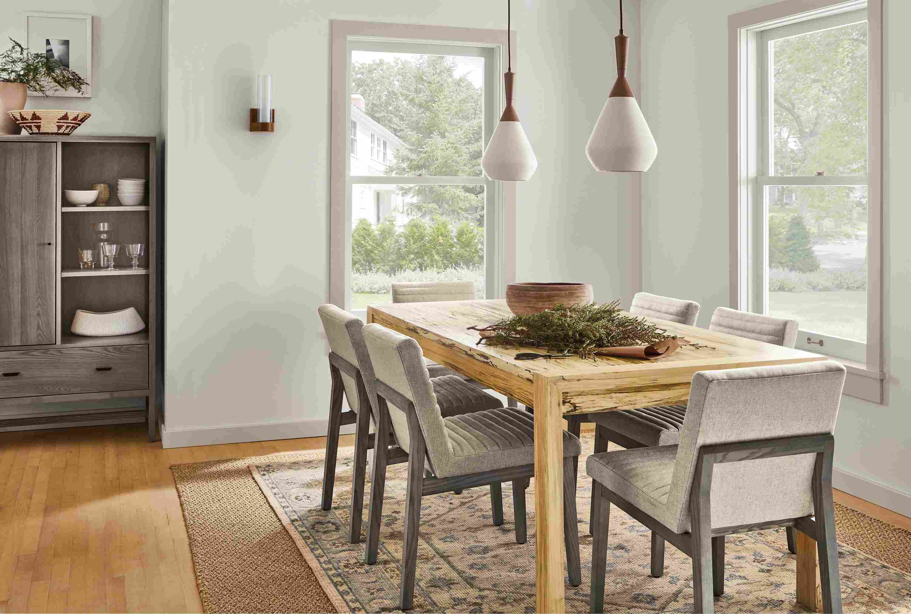 Dining room with 72-wide Walsh extension dining table, 6 Olsen dining chairs, Berkeley storage cabinet, essence rug.