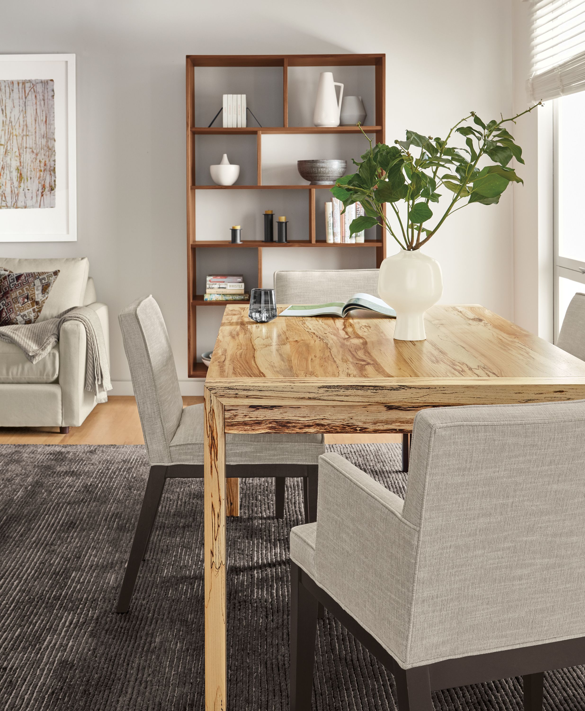 Dining room with Walsh table in spalted sugarberry and Ansel chairs in Destin Linen and Talia rug in charcoal.