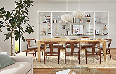 dining room with walsh table in sugarberry, 8 evan chairs in walnut, orikata pendants, foshay wall unit.