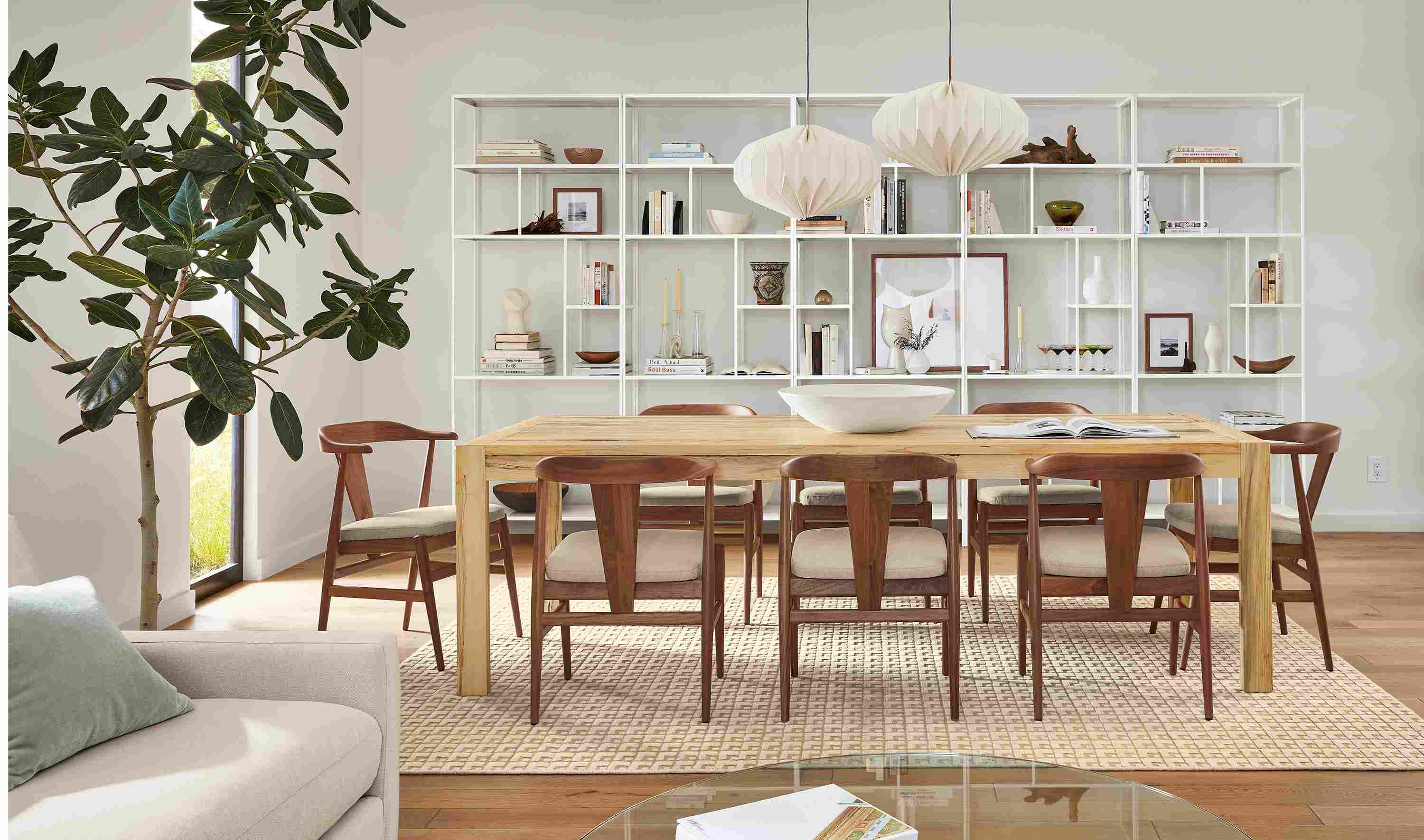 Dining room with Walsh table in sugarberry and Evan armchairs in myers taupe and walnut.