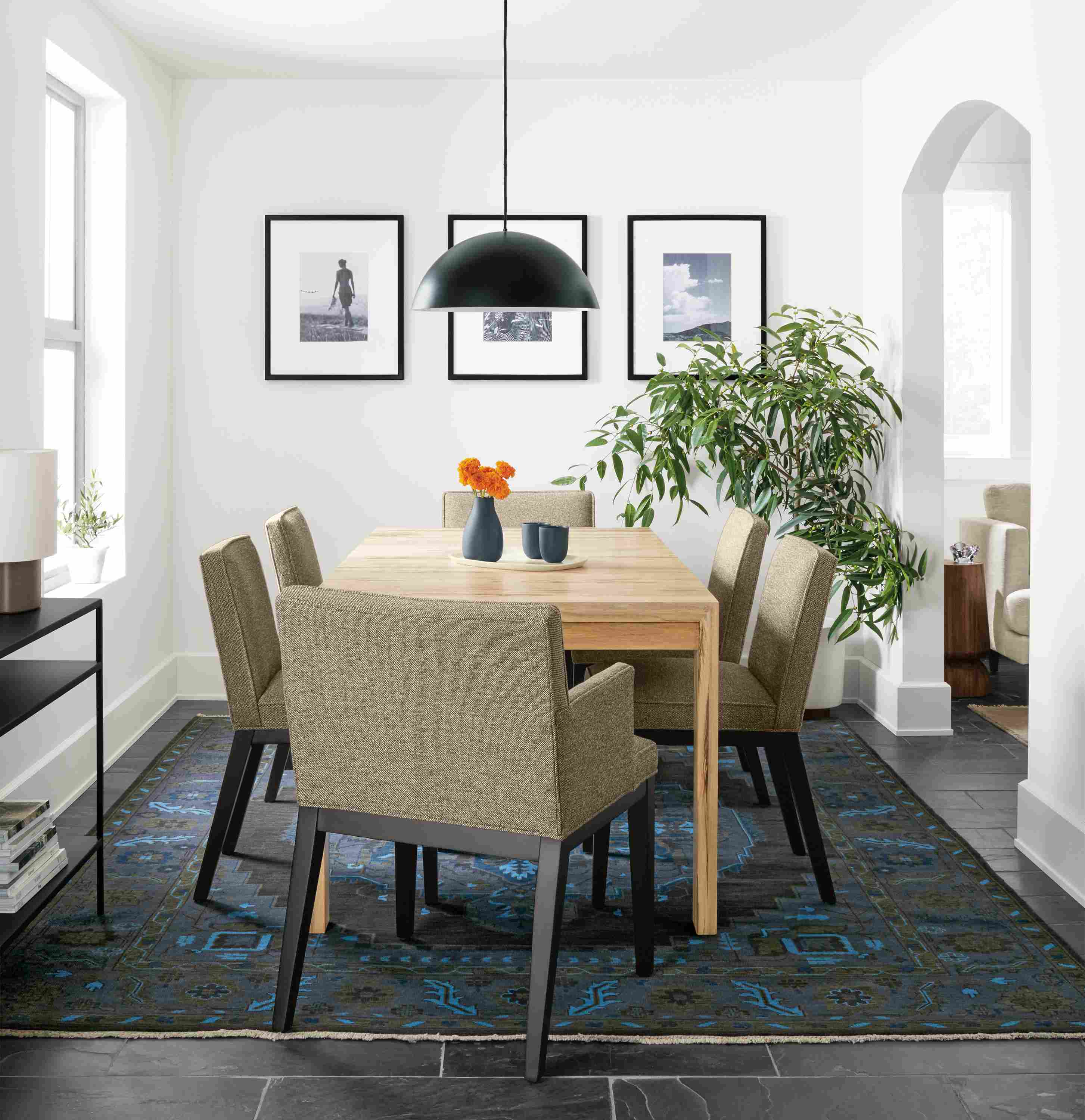 Dining room with Walsh extension table in spalted sugarberry and Ansel chairs in Tatum Gunmetal and Heriz rug.