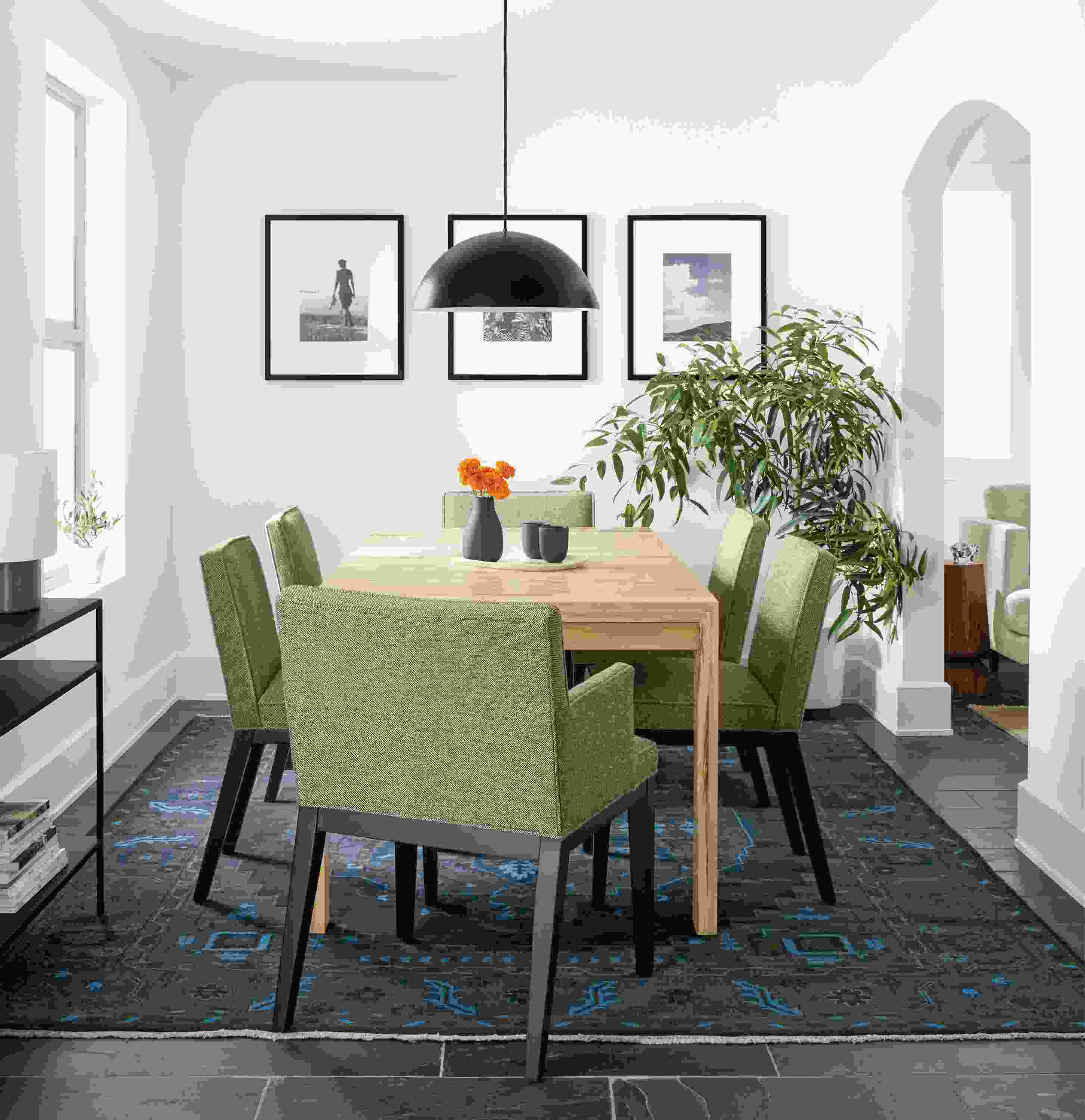 Dining room with Walsh extension table in spalted sugarberry and Ansel chairs in Tatum Gunmetal and Heriz rug.