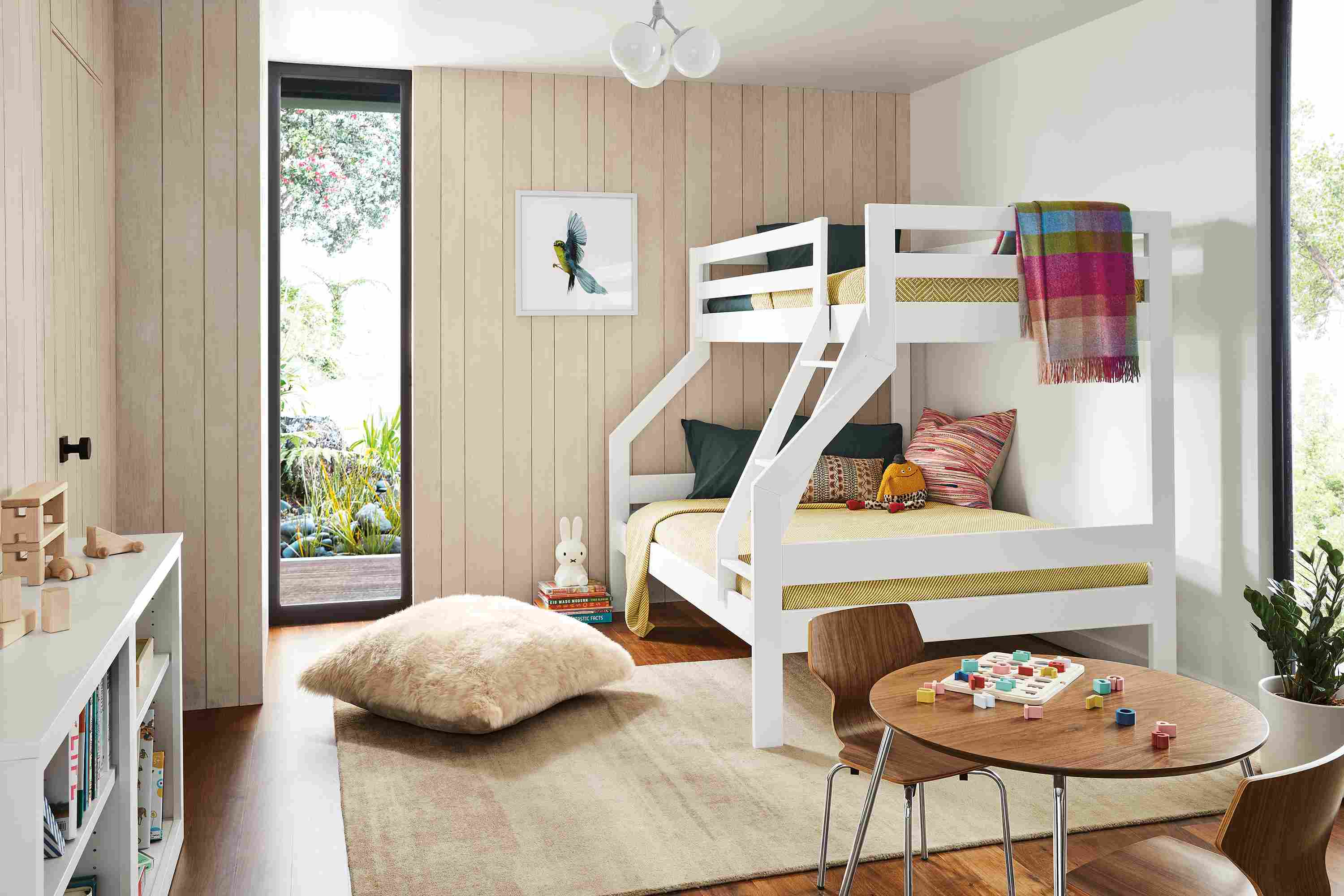 Kid's bedroom setting including Waverly duo bunk, Woodwind bookcases, Perch table and Perch chairs.