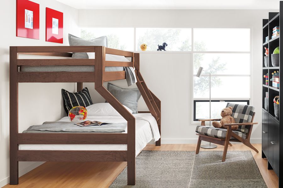 room setting including waverly duo bunk bed, sanna chair, addison bookcases and traverse rug.