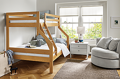 Bedroom with Waverly twin over full bunk bed in white oak, Emerson nightstand in white and Eos swivel chair in view grey.