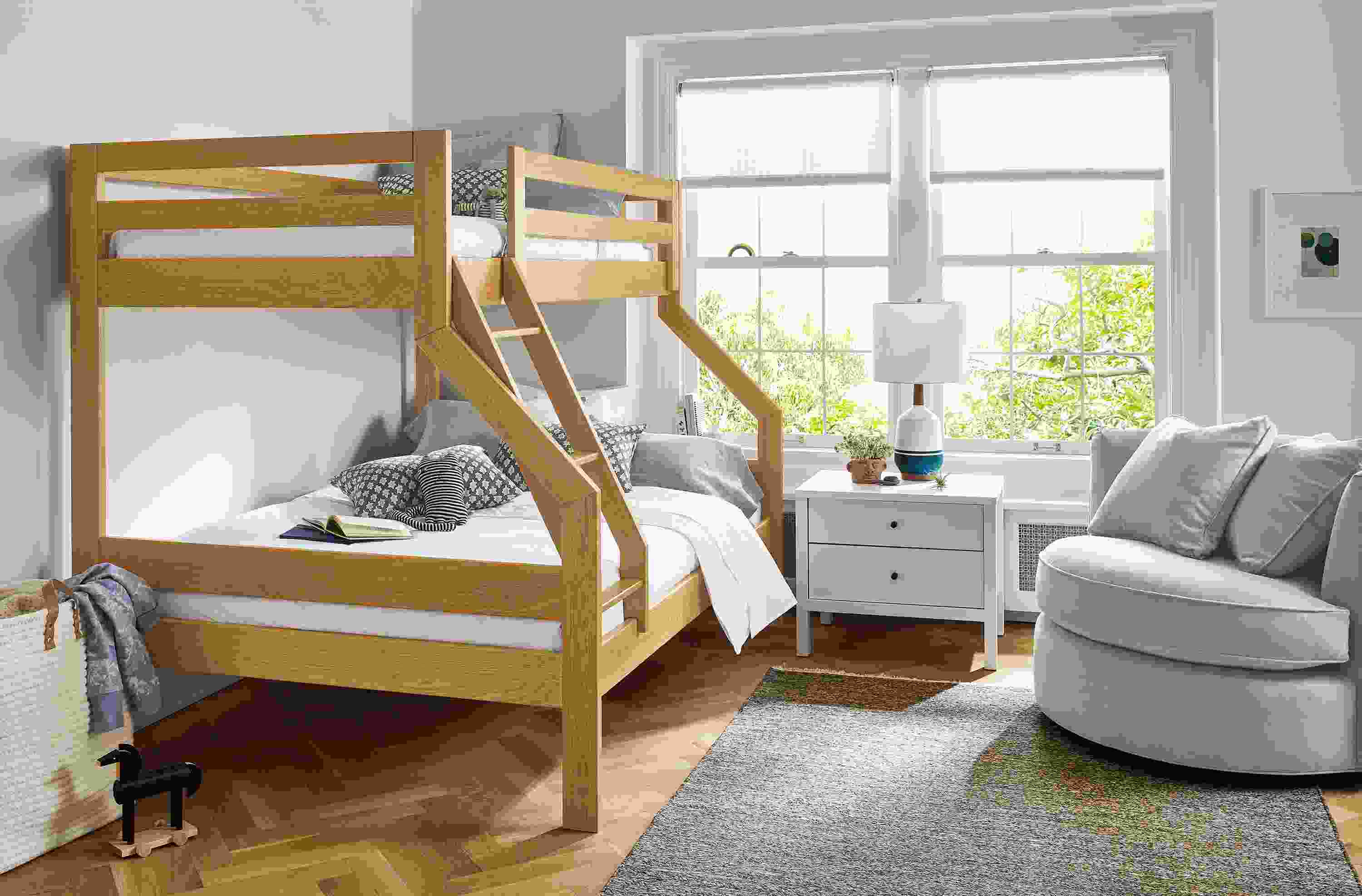 Bedroom with Waverly twin over full bunk bed in white oak, Emerson nightstand in white and Eos swivel chair in view grey.