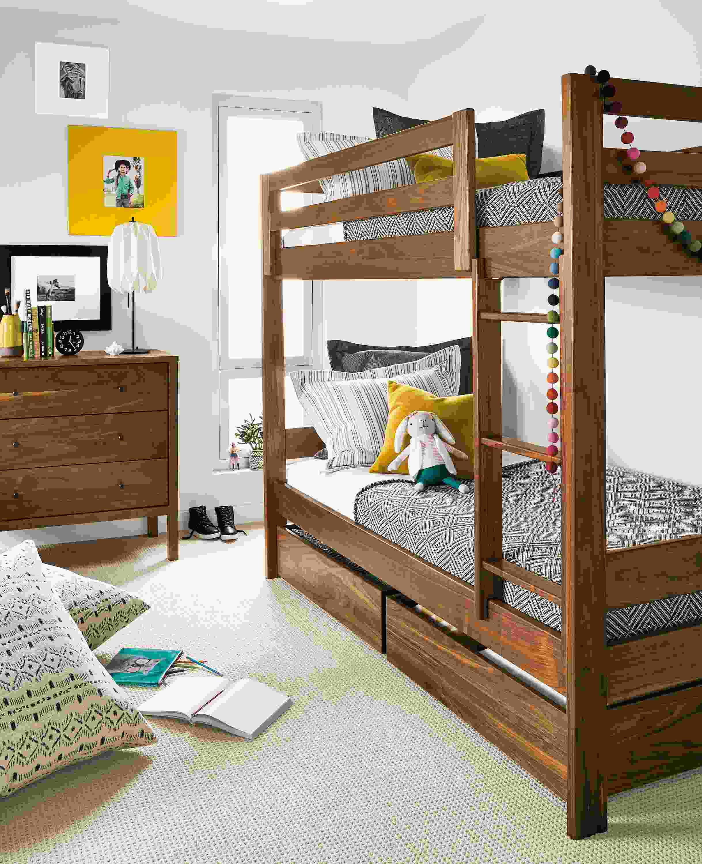 Detail of Waverly twin bunk in walnut in kids' bedroom.