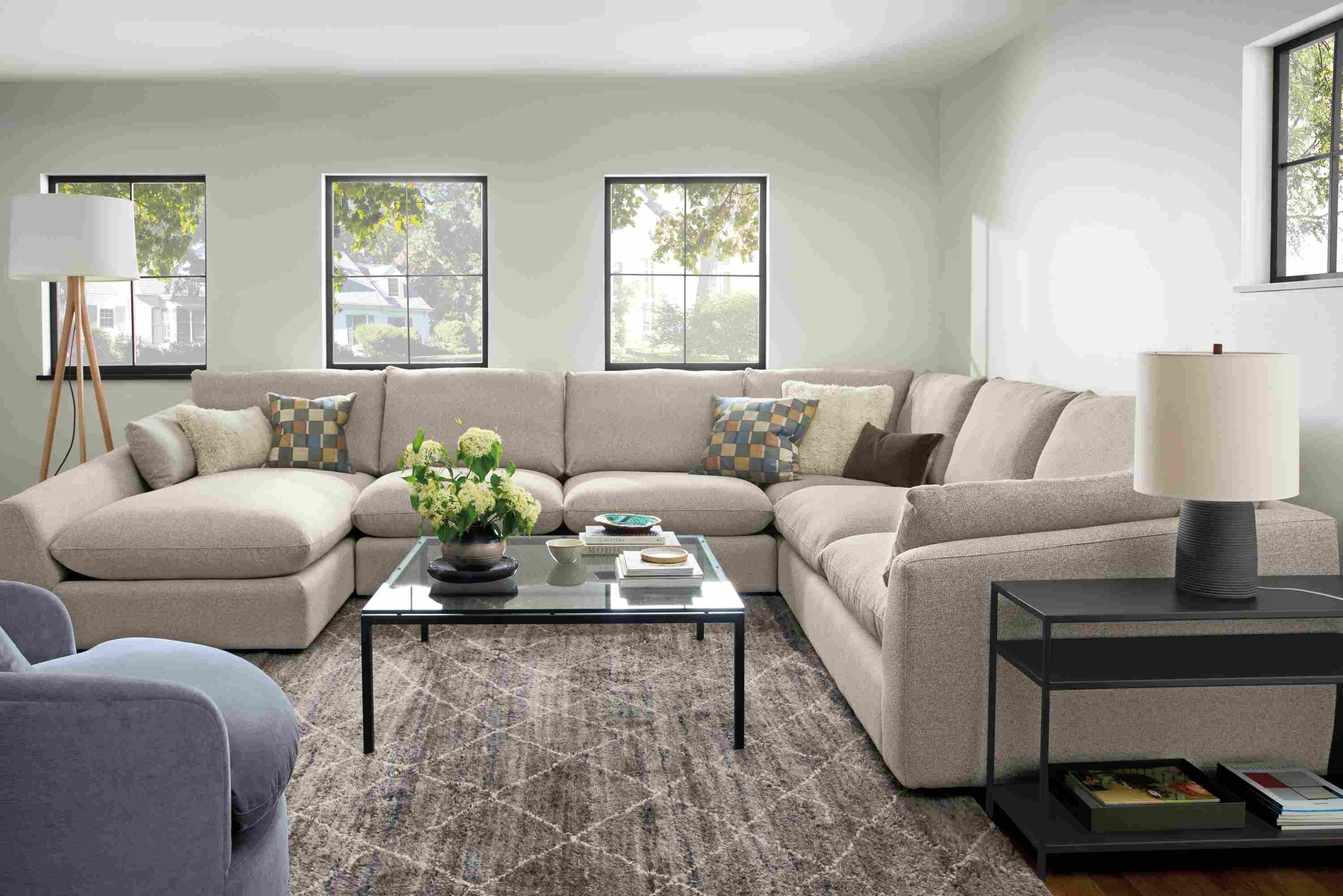 Living room with a Weber 4-piece sectional in Tatum Fabric and a Kalindi rug 8 by 10 rug in charcoal.