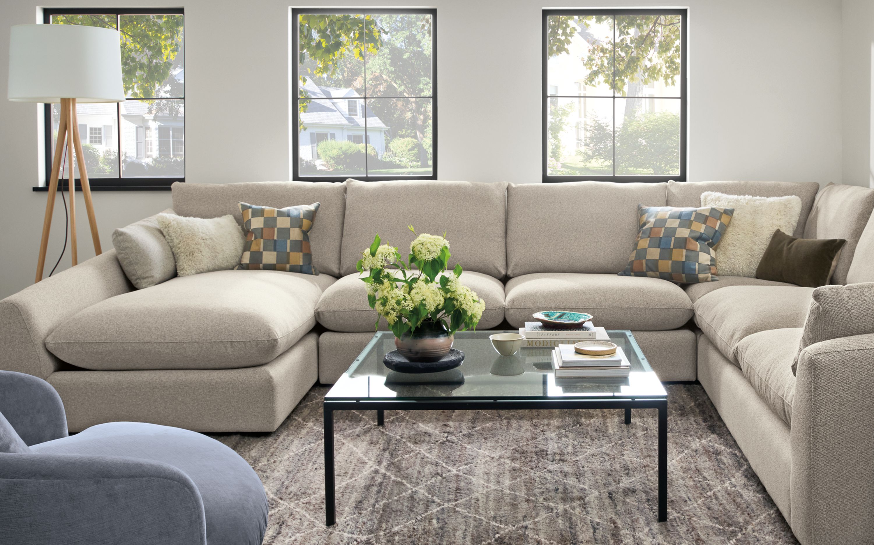 Living room with a Weber 4-piece sectional in Tatum Fabric and a Kalindi rug 8 by 10 rug in charcoal.