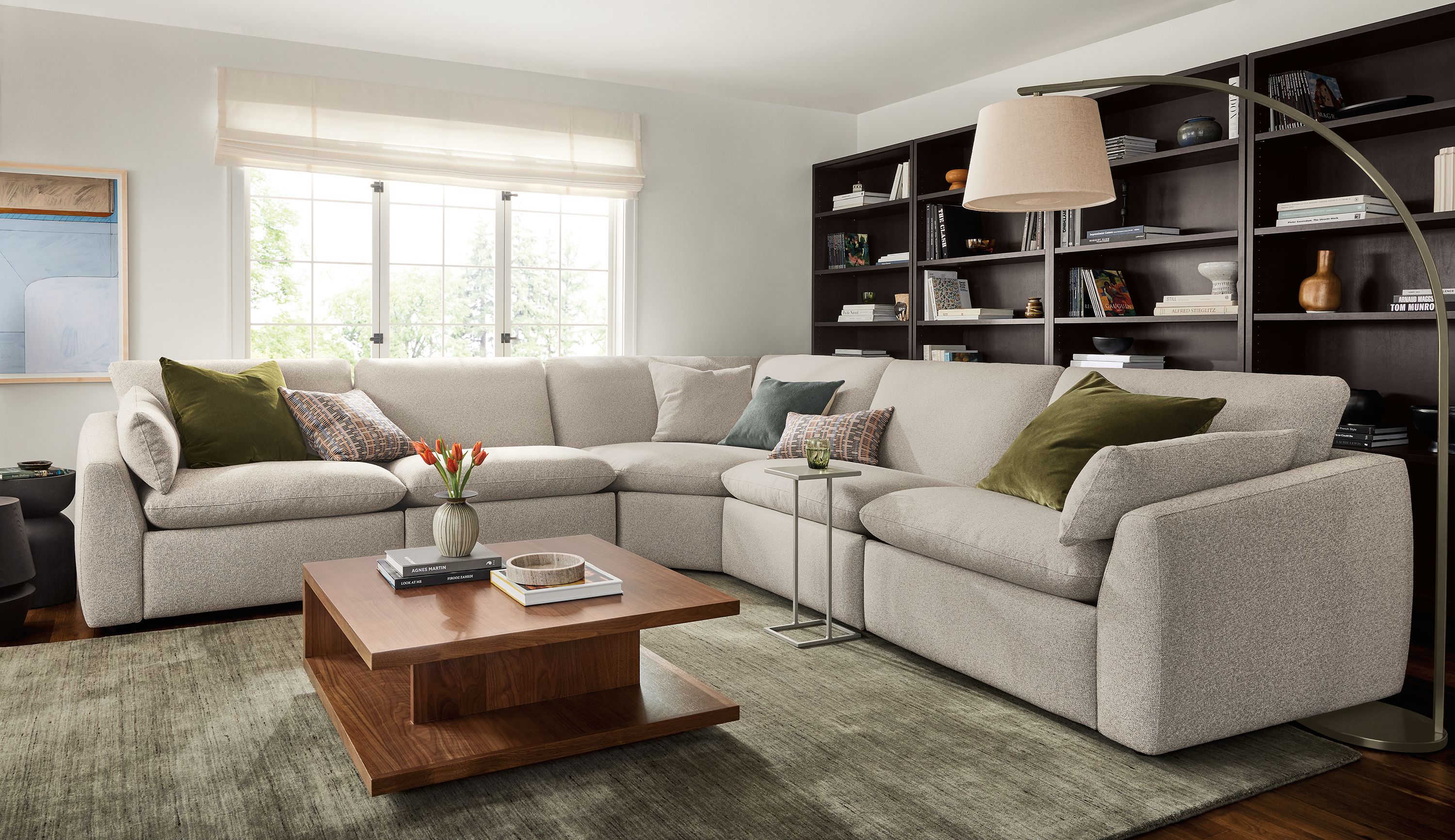 Large living room with Weber 133 by 133 5-piece sectional power recliner in tatum bone and graham coffee table in walnut.