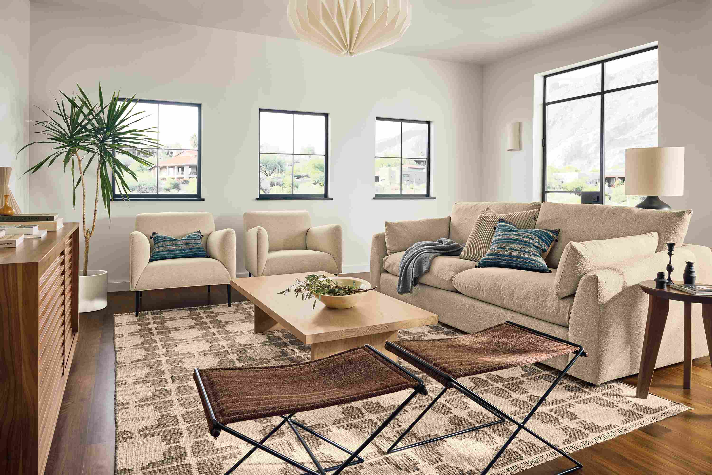 Living room with Weber 96-wide sofa in Declan Camel, 2 Matteo chairs in Tatum Natural and Tinsley rug in putty.