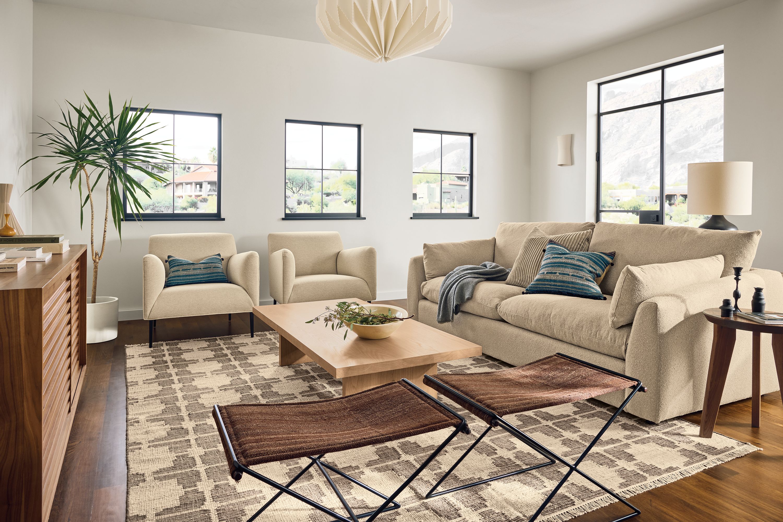 Living room with Weber 96-wide sofa in Declan Camel, 2 Matteo chairs in Tatum Natural and Tinsley rug in putty.
