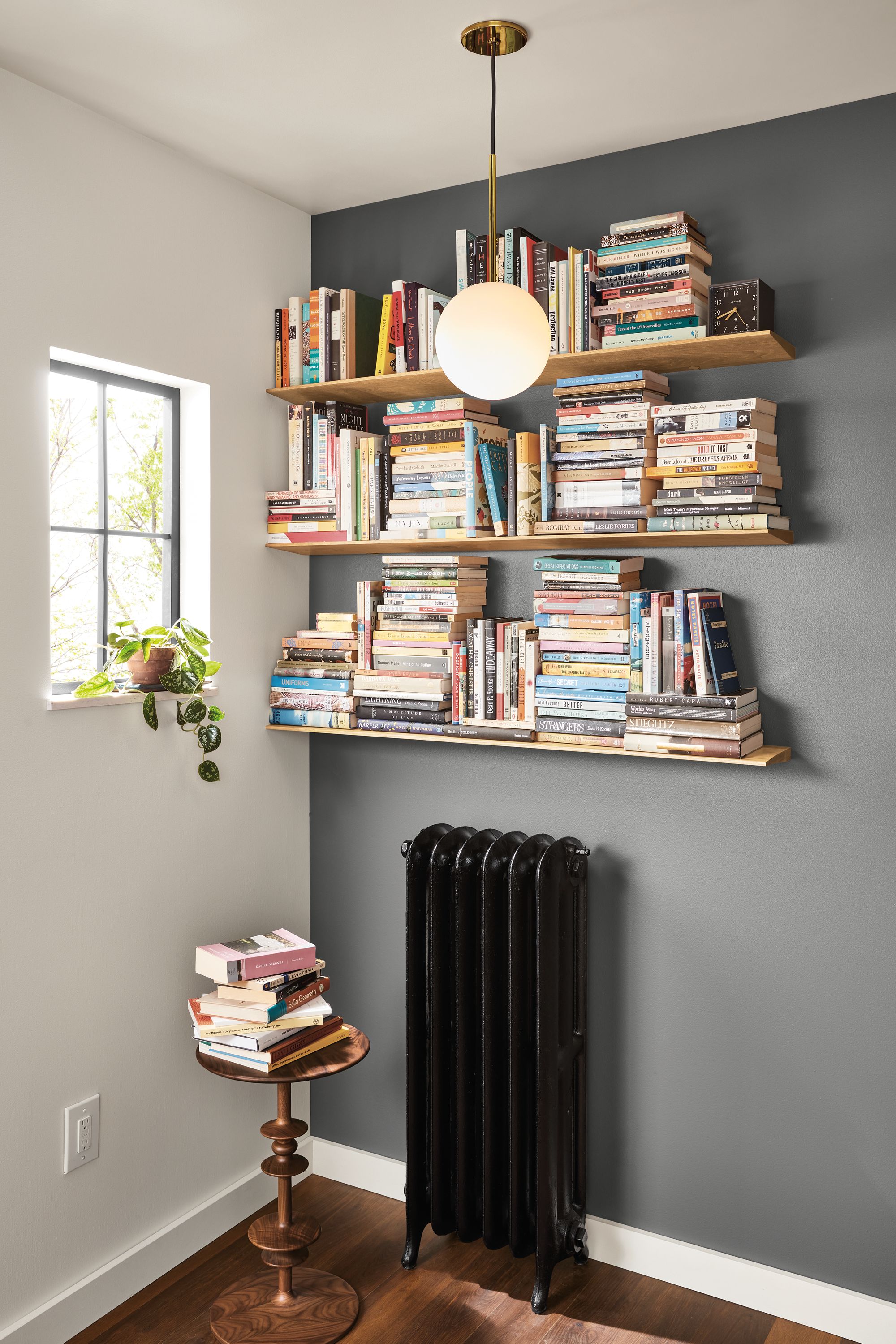 Detail of wedge wall shelves in white oak, Orbit pendant light and Parks end table in walnut.