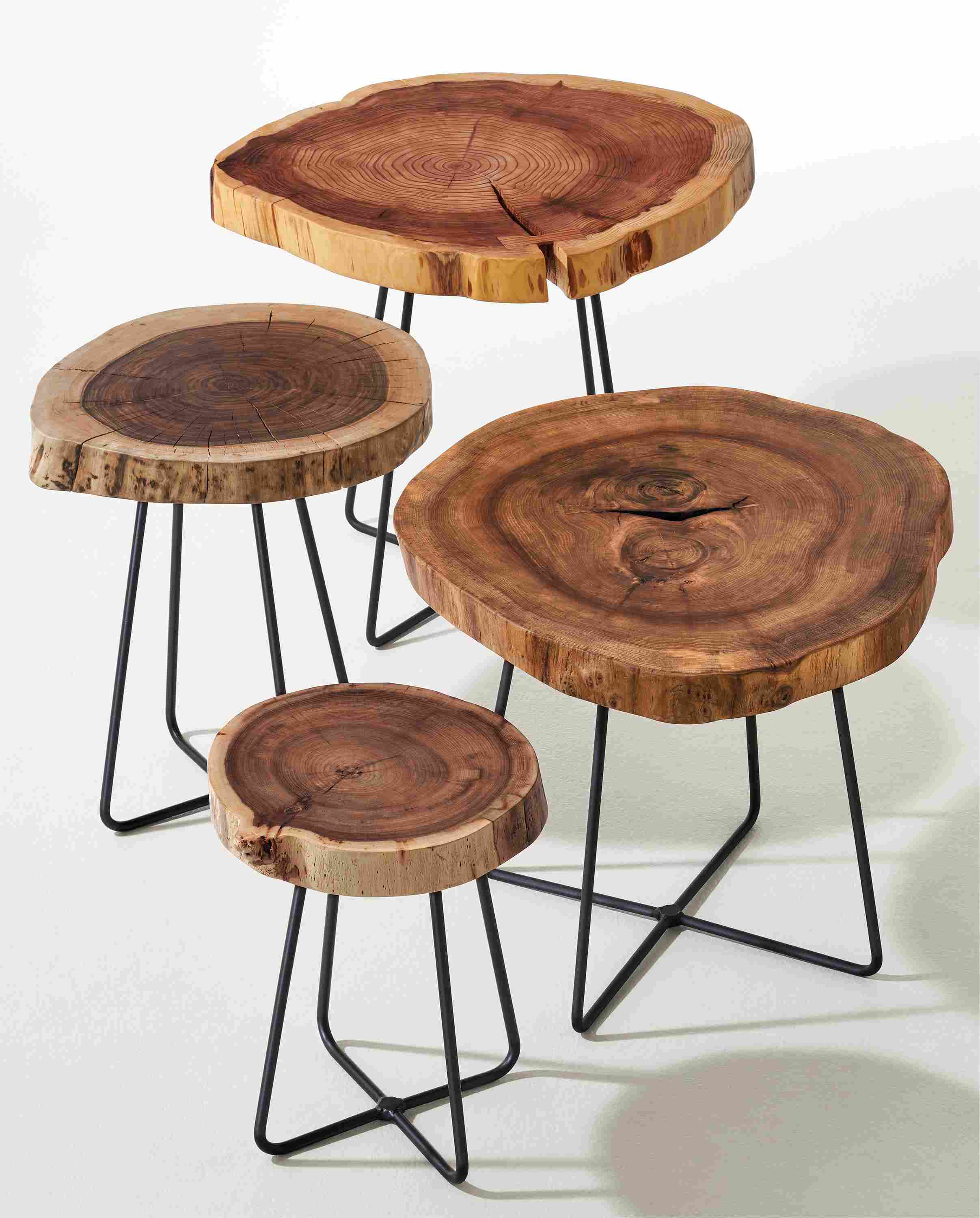 Detail of four sizes of Wellington end tables with reclaimed wood cookie tops.