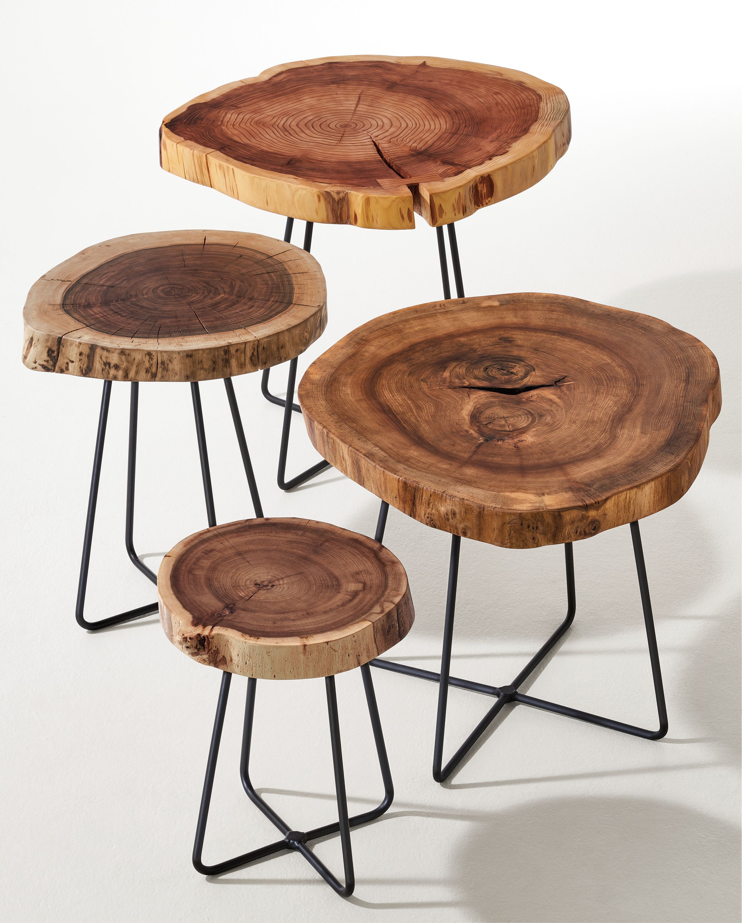 Detail of four sizes of Wellington end tables with reclaimed wood cookie tops.