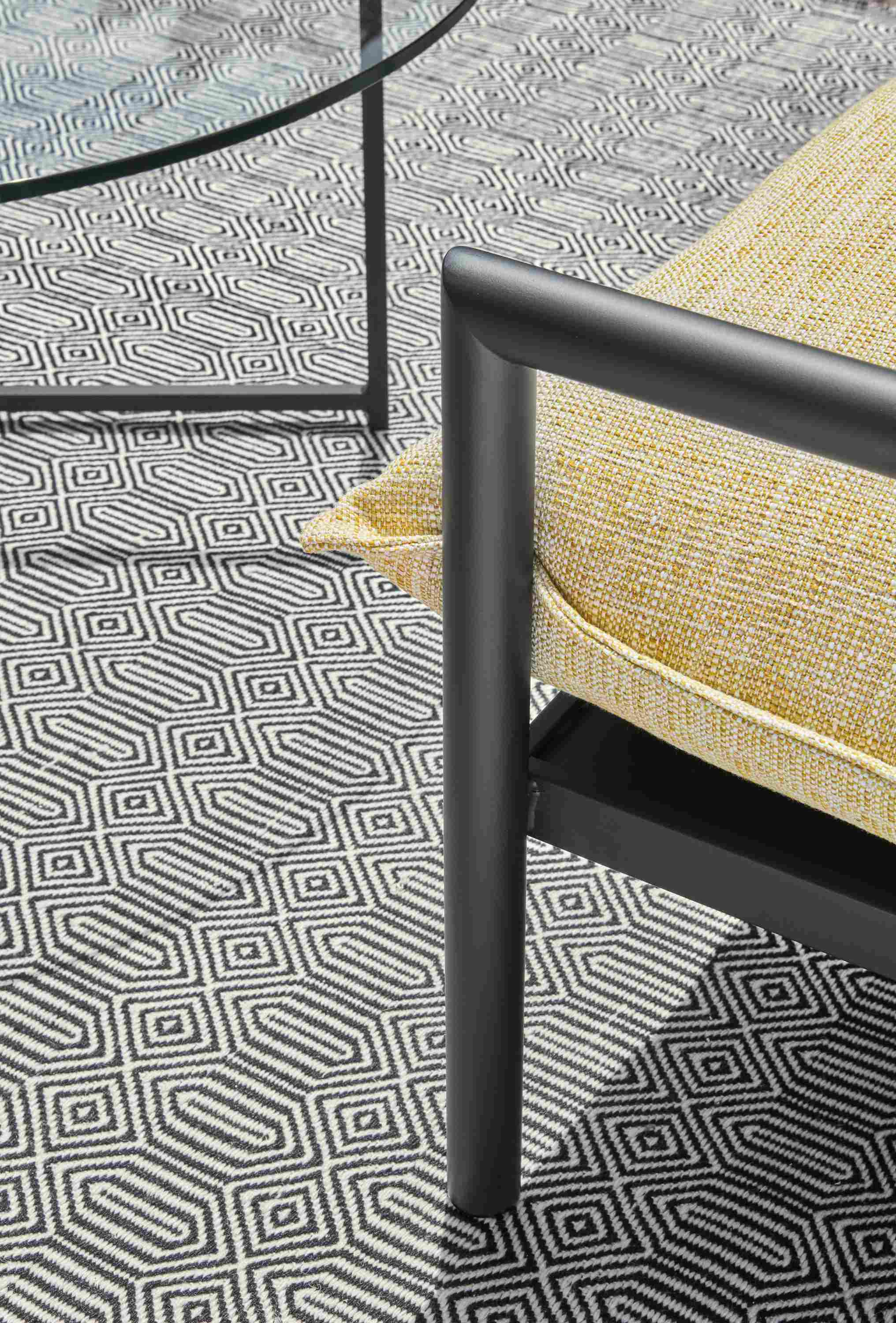 Patio with detail of Westbrook sofa, classic coffee table, sequence rug in Ivory/Black.