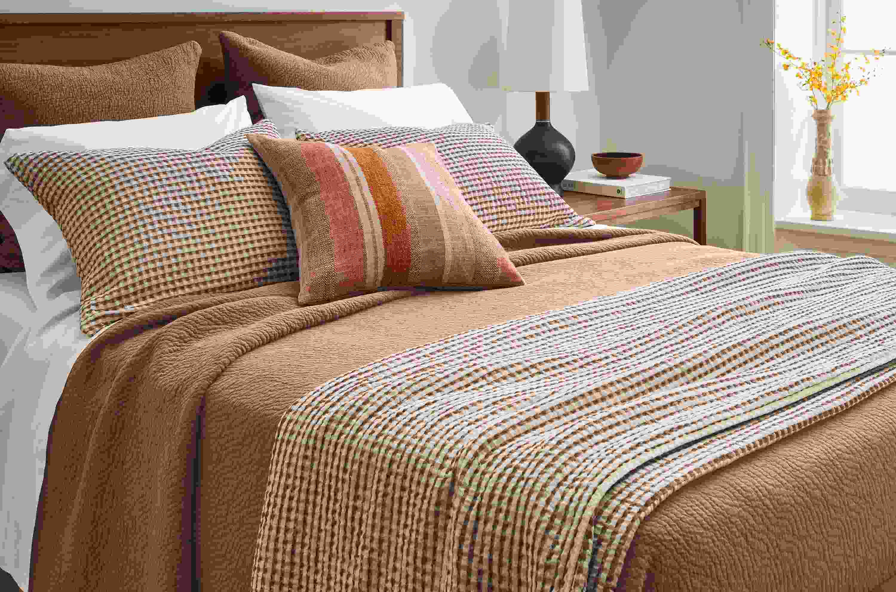 Bedroom with Westin coverlet set and Thea matelasse coverlet and pillow shams all in brick.