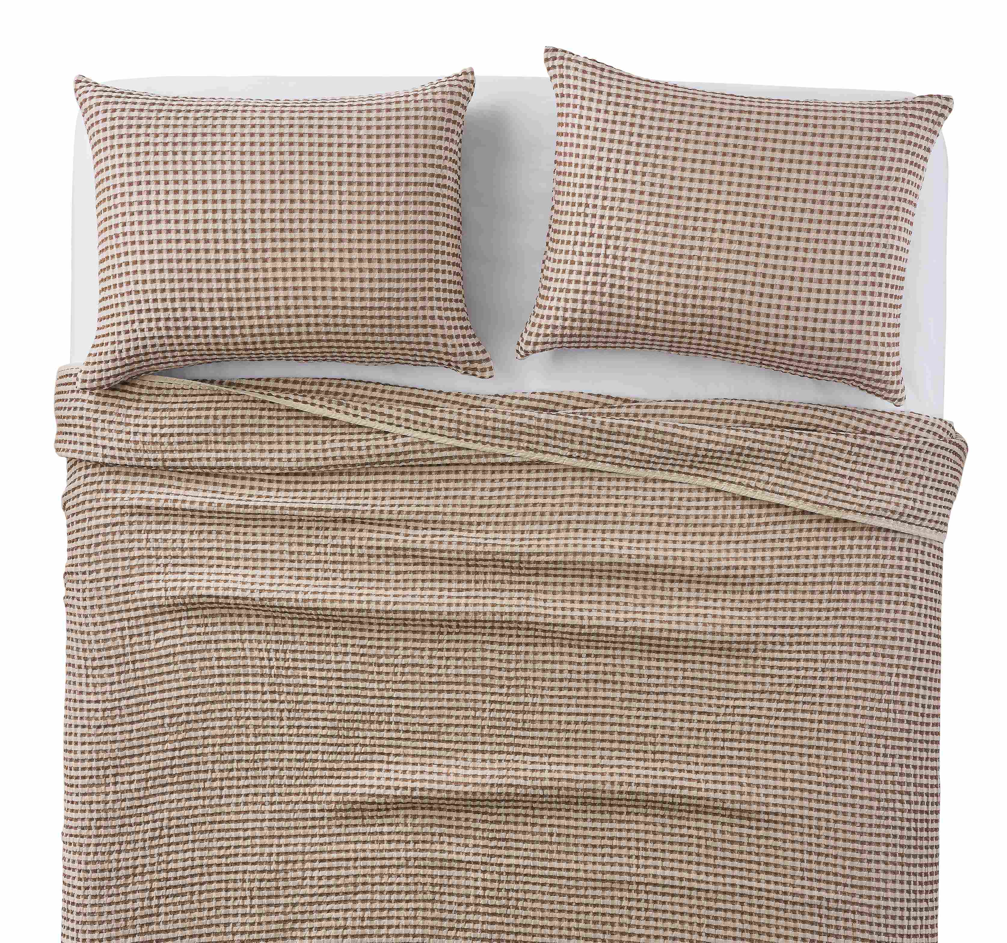Overhead view of westin full/queen coverlet set in brick on a bed.