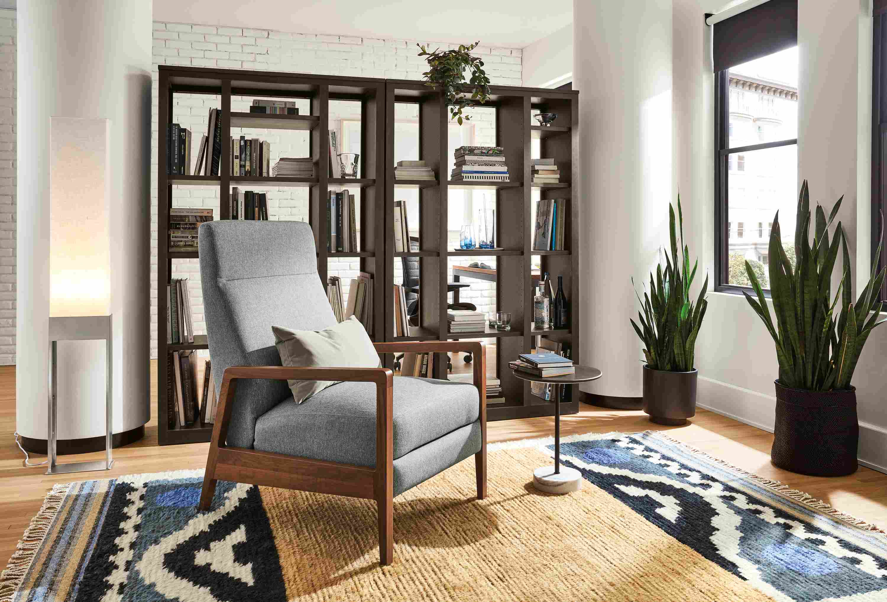 Living room with Westport recliner, Woodwind bookcases, Parsons table and Finora office chair.