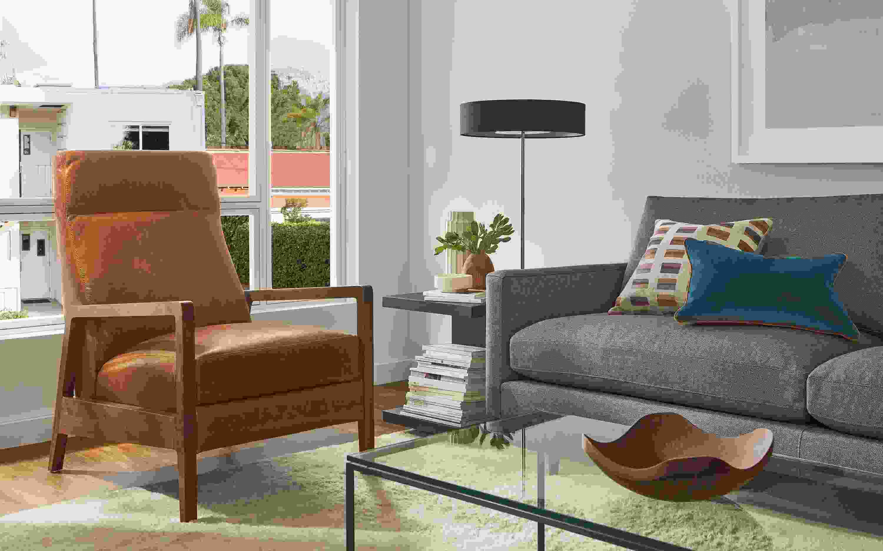 Living room with Westport recliner in walnut and Cyrus Pecan leather, Jasper sofa, Cohen table lamp.