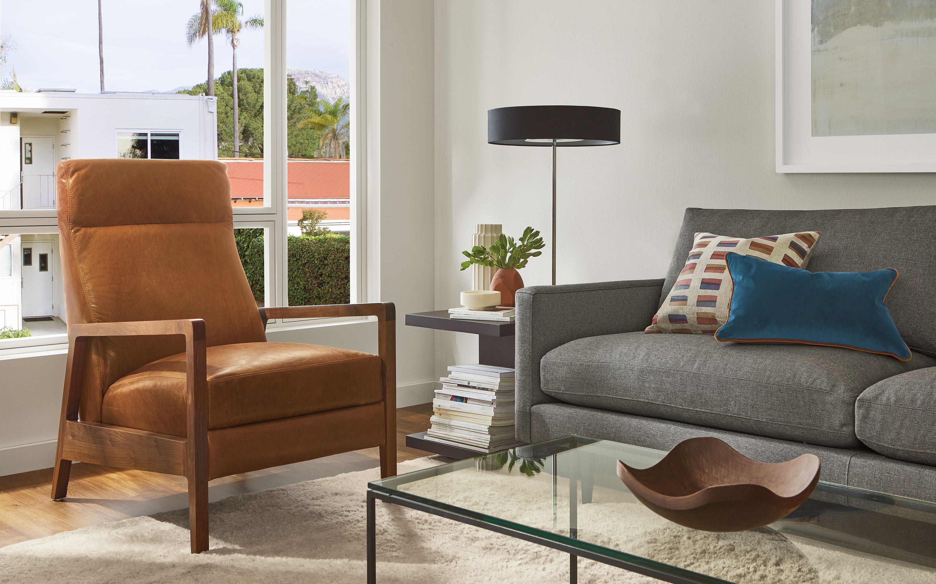 Living room with Westport recliner in walnut and leather, Jasper sofa, Cohen table lamp.