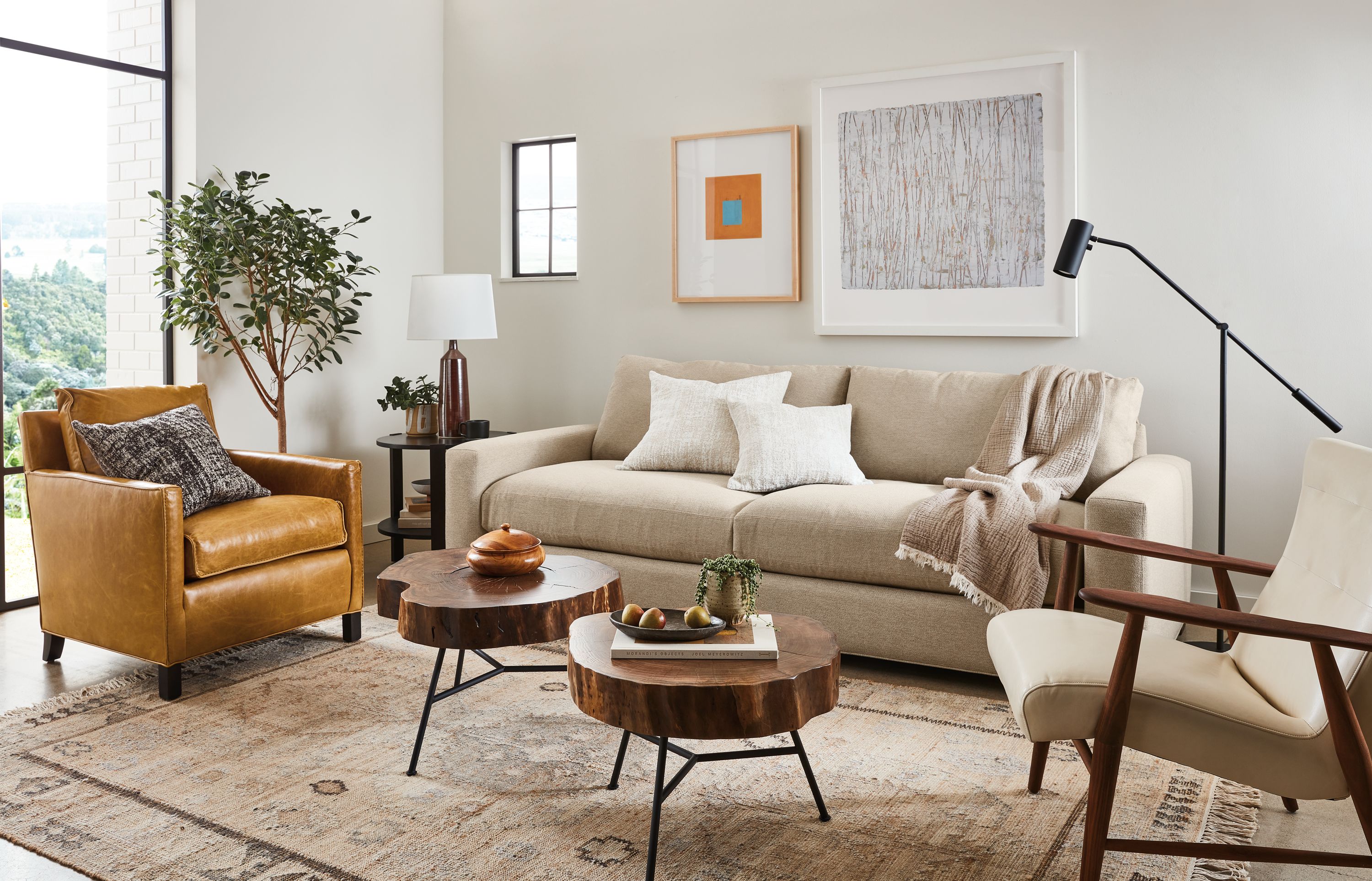 room setting including metro sofa, wheatland coffee tables, bram chair, jonas lounge chair, villa rug.