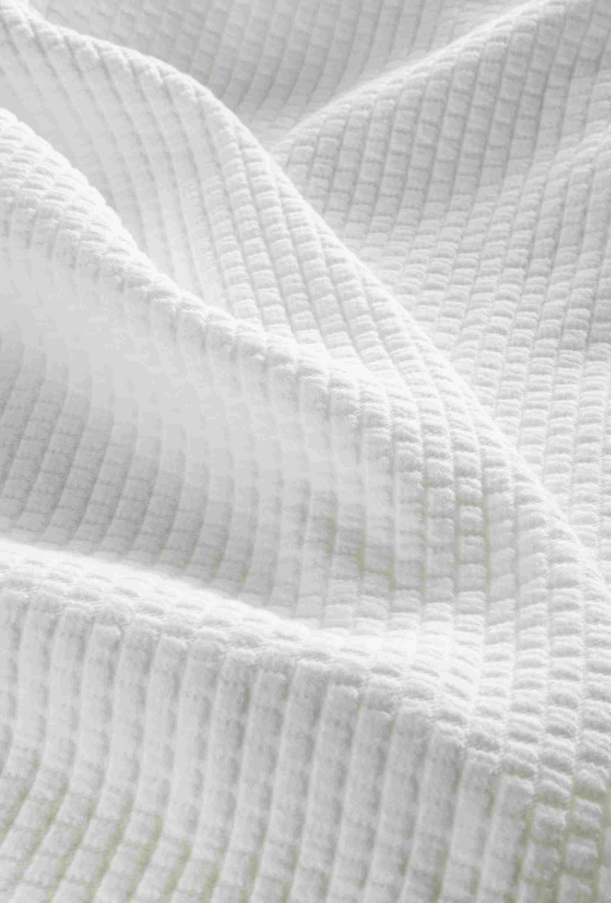 Detail of Whitemore matelasse coverlet in white.