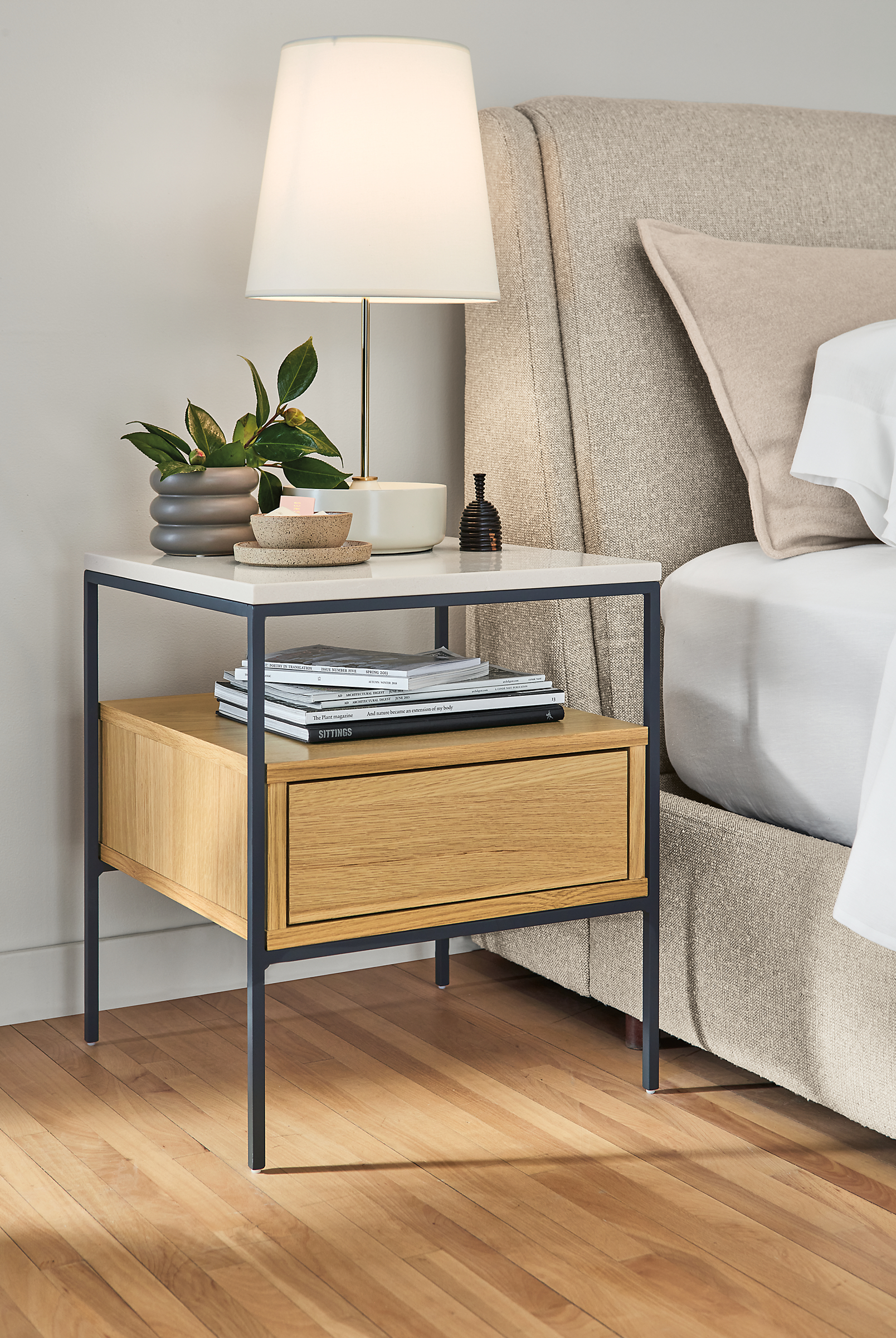 detail of williams end table with capstone table lamp beside nora bed.