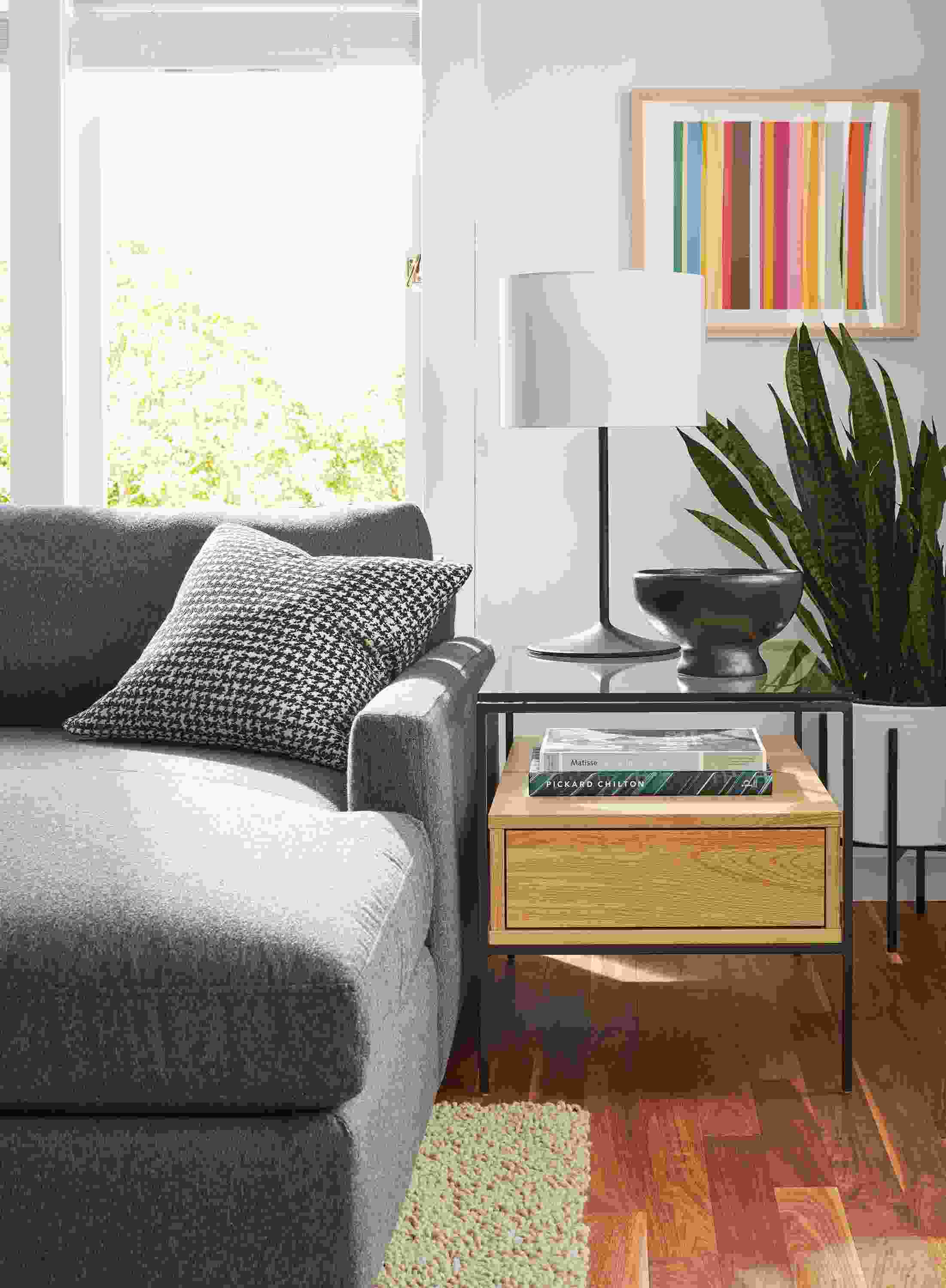 Room setting including linger 5-piece sectional, Arden rug, Williams end table and Fremont lamp.