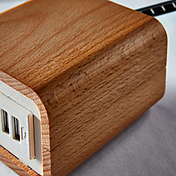 Detail of Willow Tabletop Power and Charging Outlet in Beech and White.
