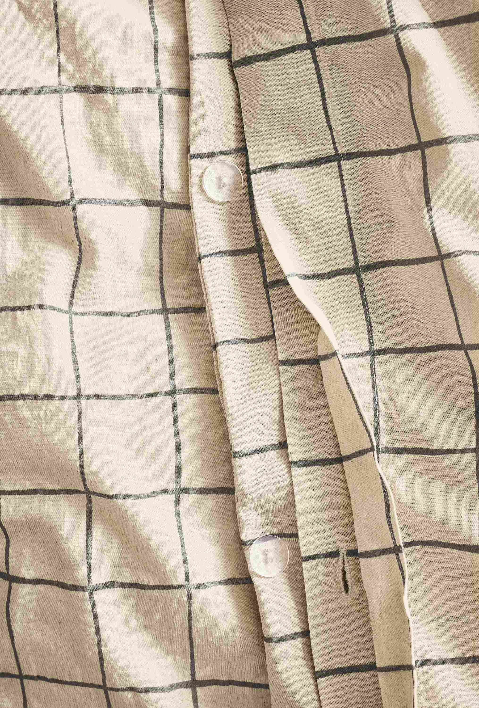 Close-up of button closure on Window full/queen duvet set in charcoal.