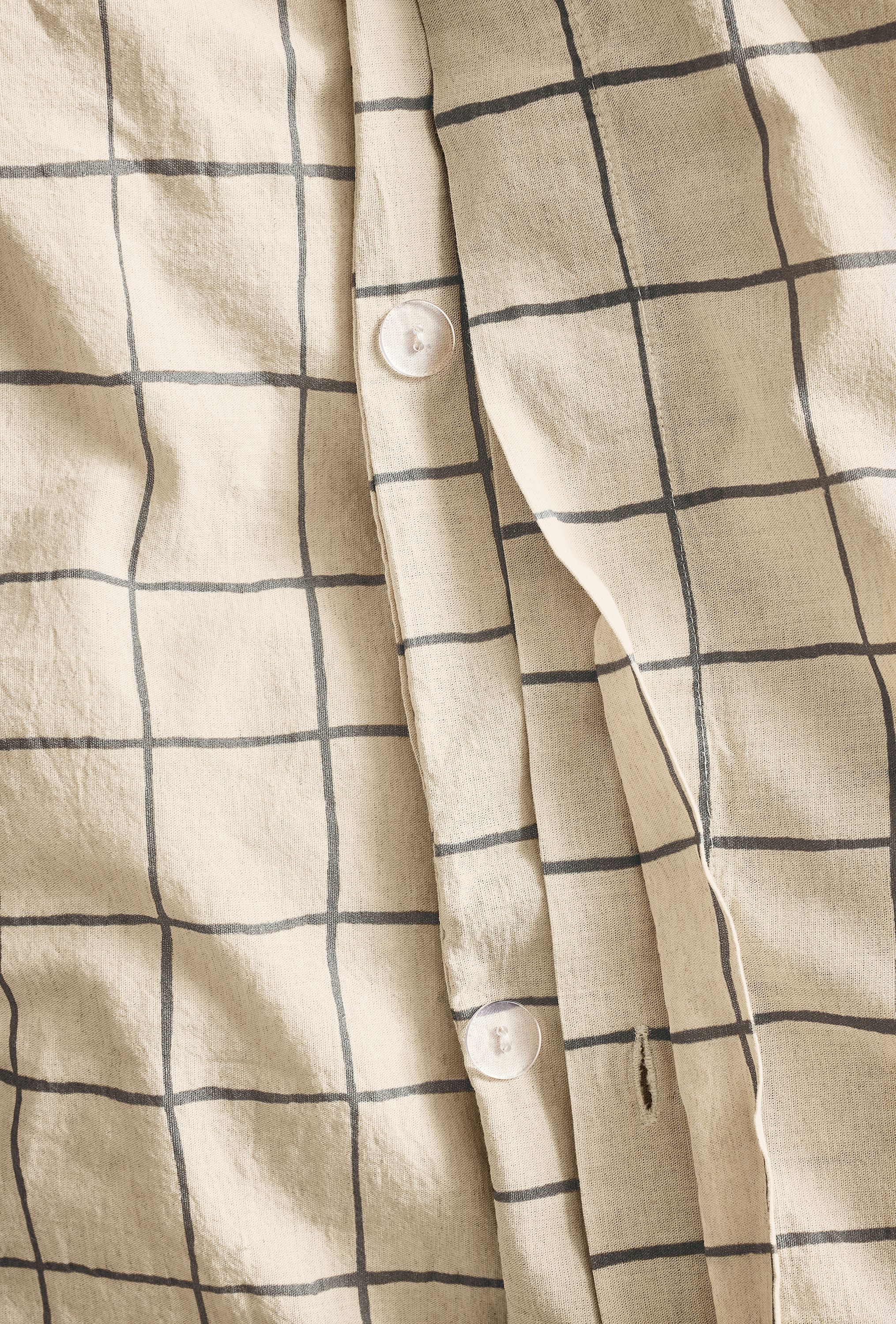 Close-up of button closure on Window full/queen duvet set in charcoal.