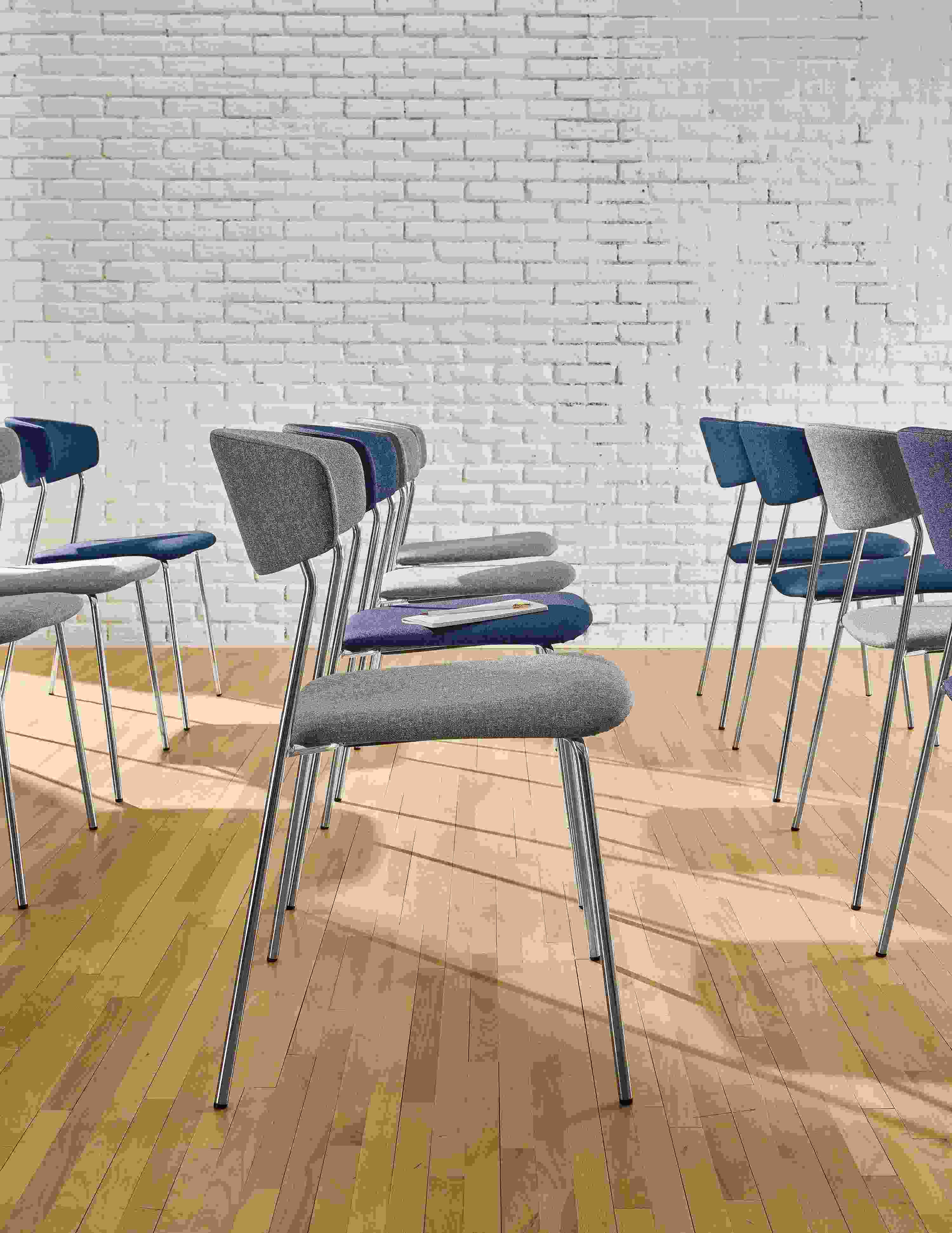 Detail of Wolfgang side chairs in grey and ink.