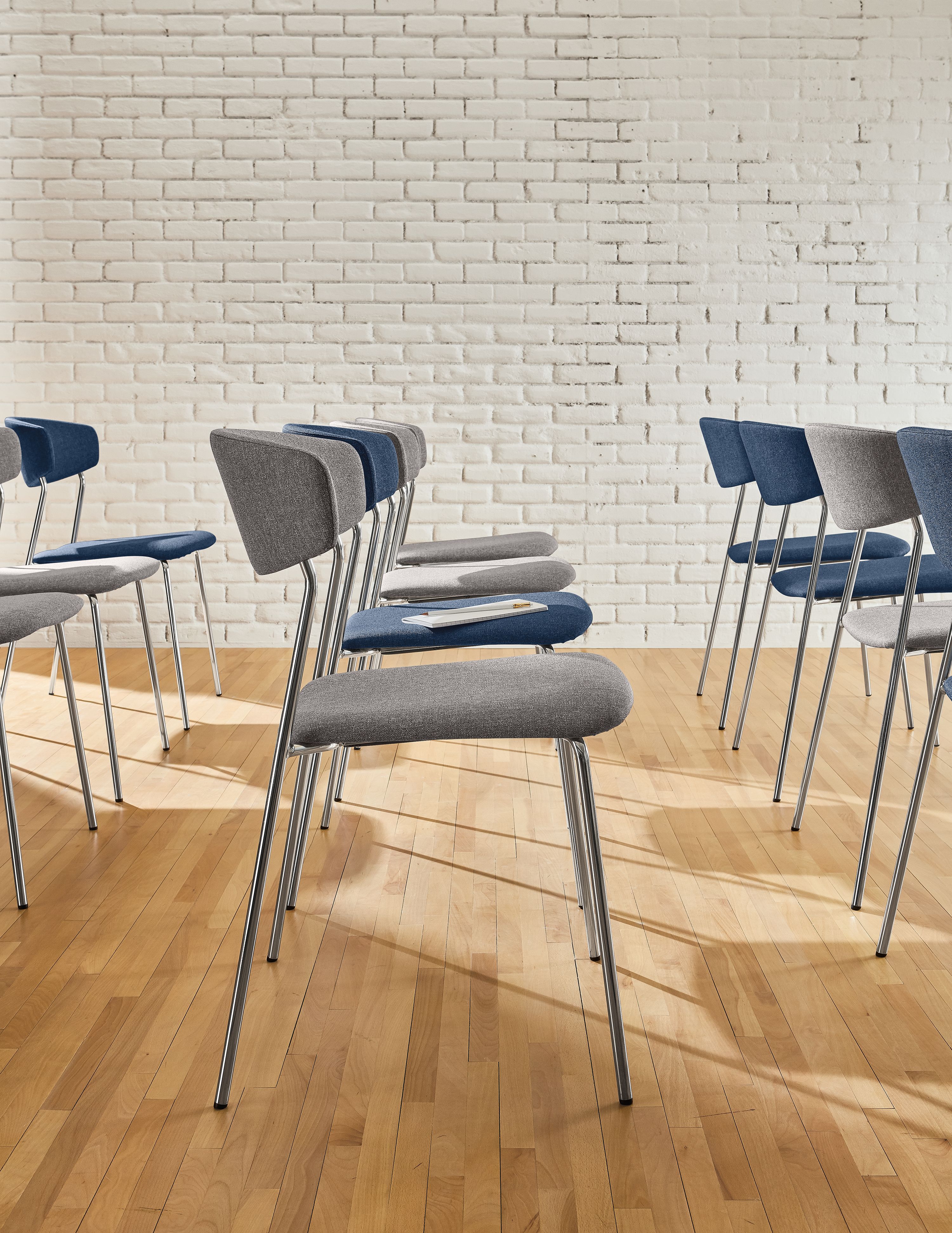 Detail of Wolfgang side chairs in grey and ink.