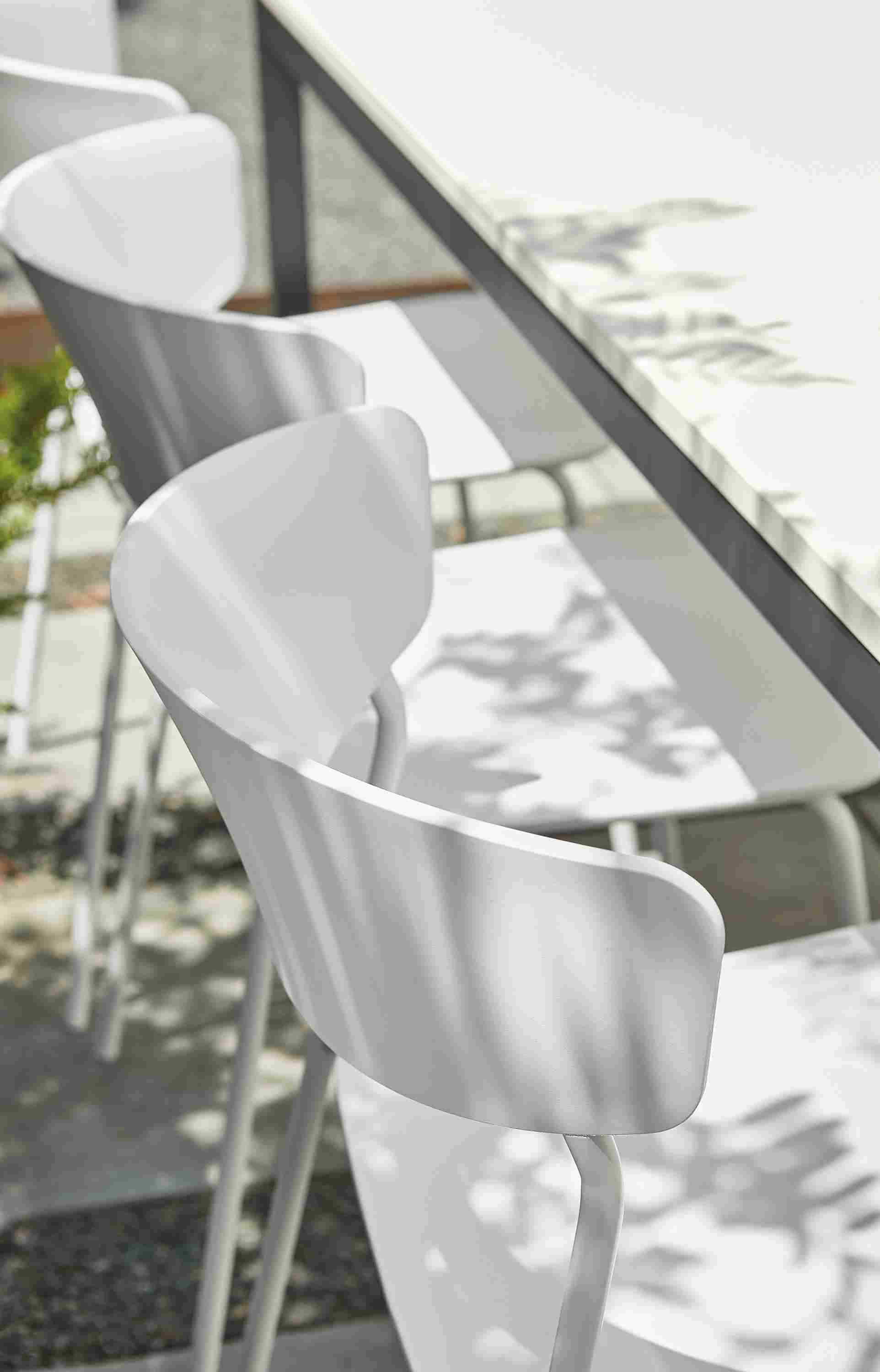 Outdoor space with wolfgang side chairs at parsons outdoor table.