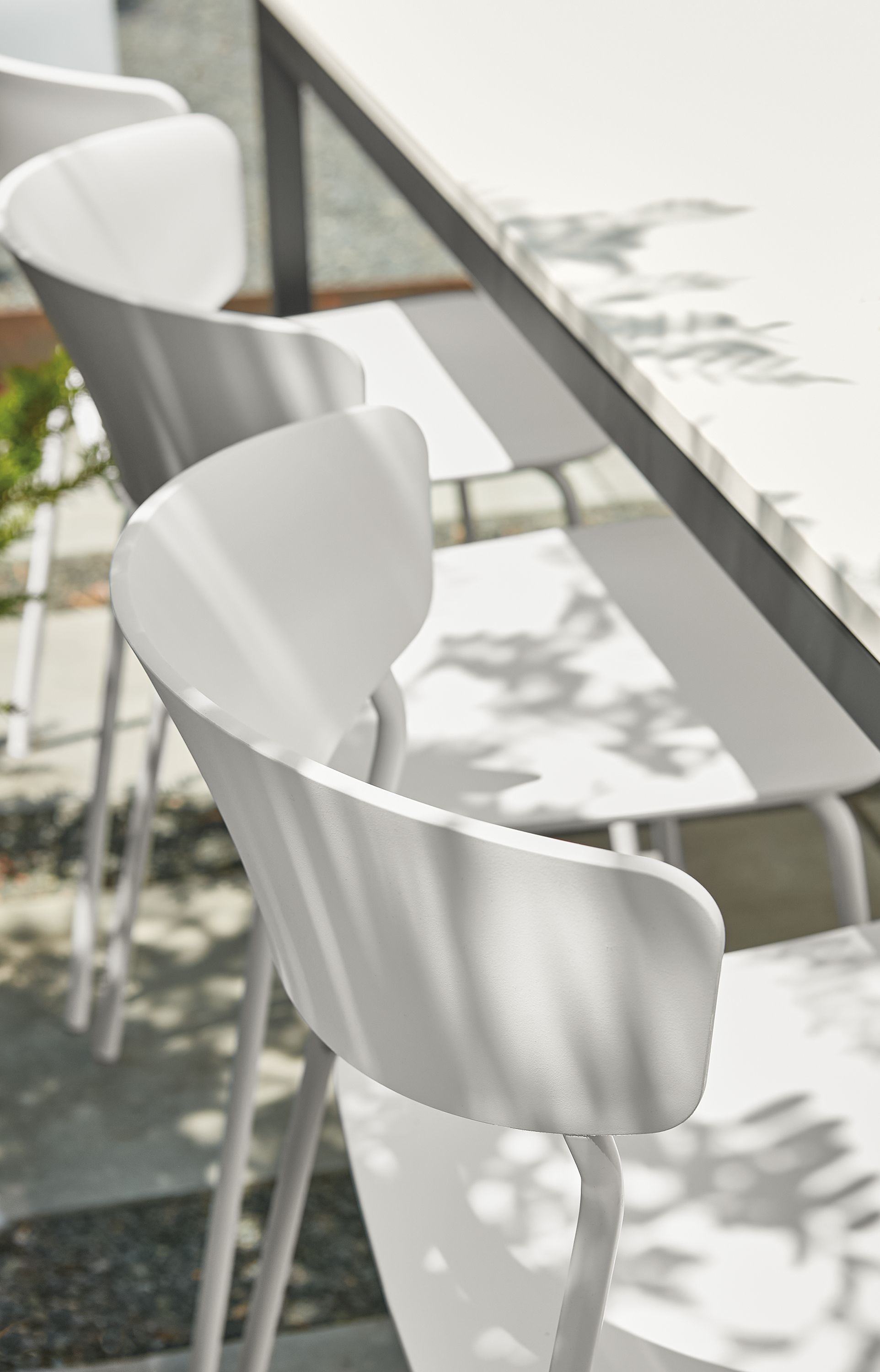 Outdoor space with wolfgang side chairs at parsons outdoor table.