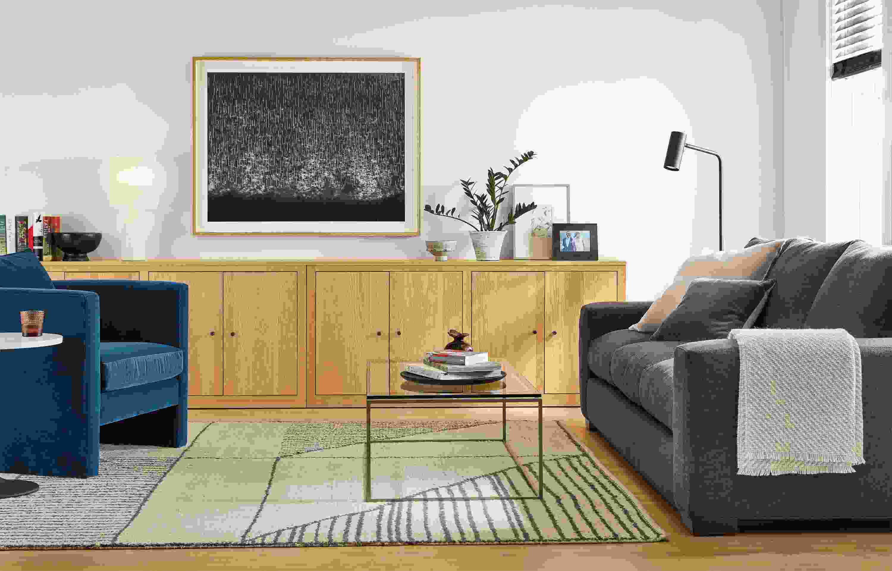 Detail of living room with Metro sofa, Silva chair and Woodwind bookcases.